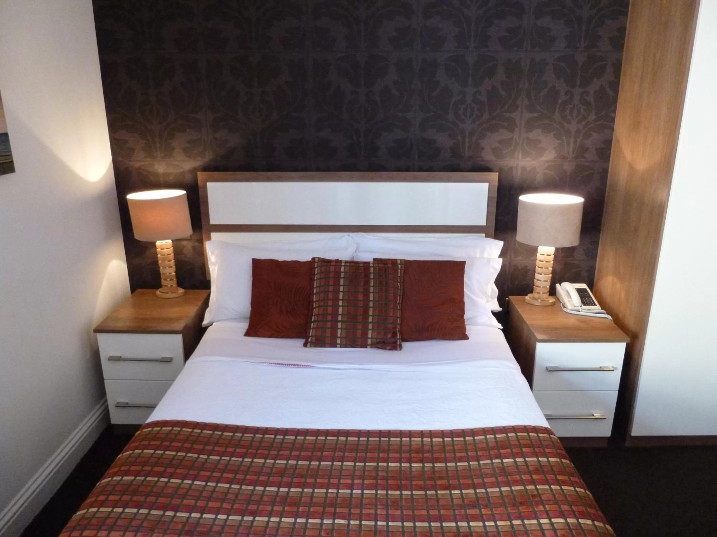 Decorative detail, Bed in The White Lady Hotel