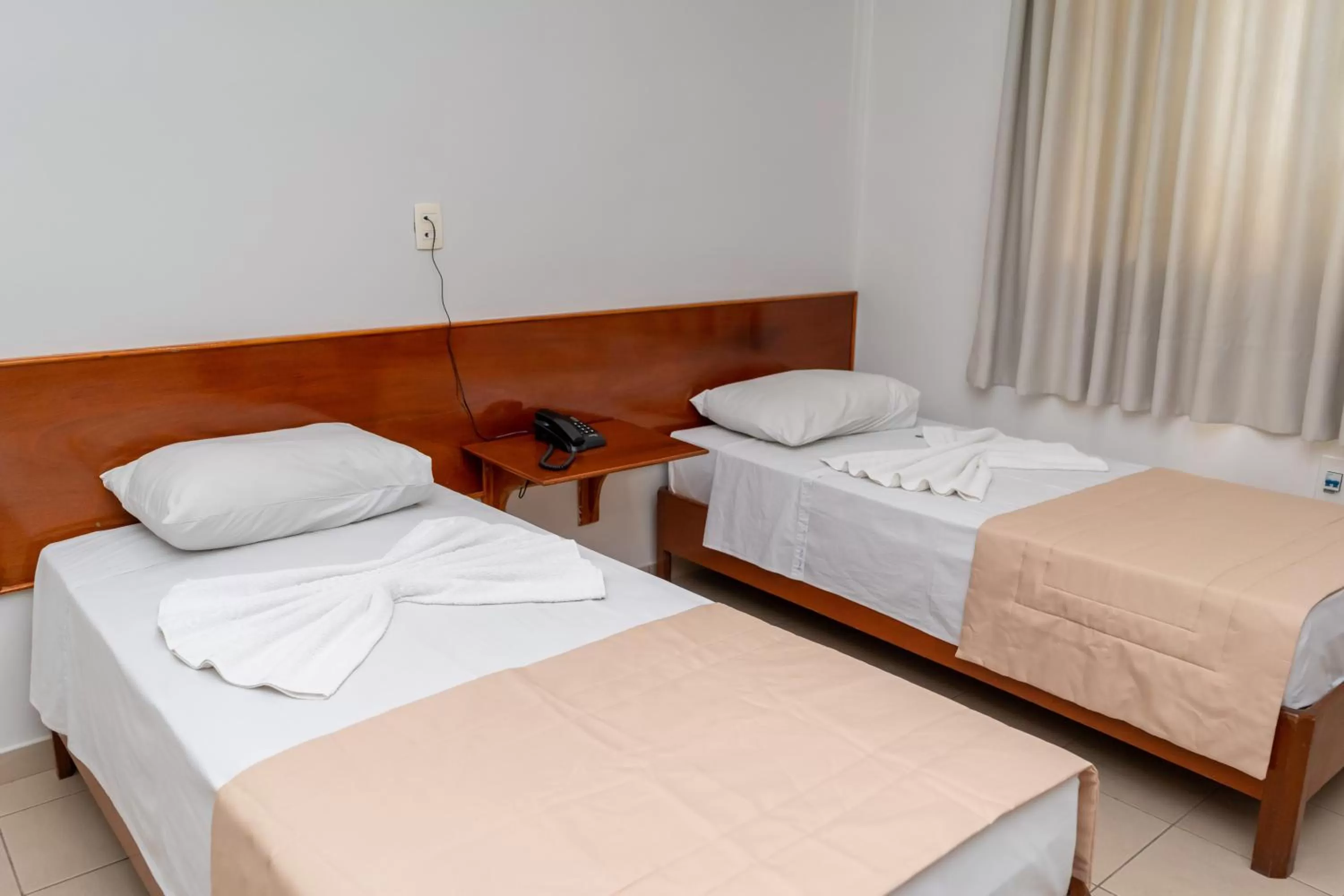 Bed in Bandeirantes Hotel