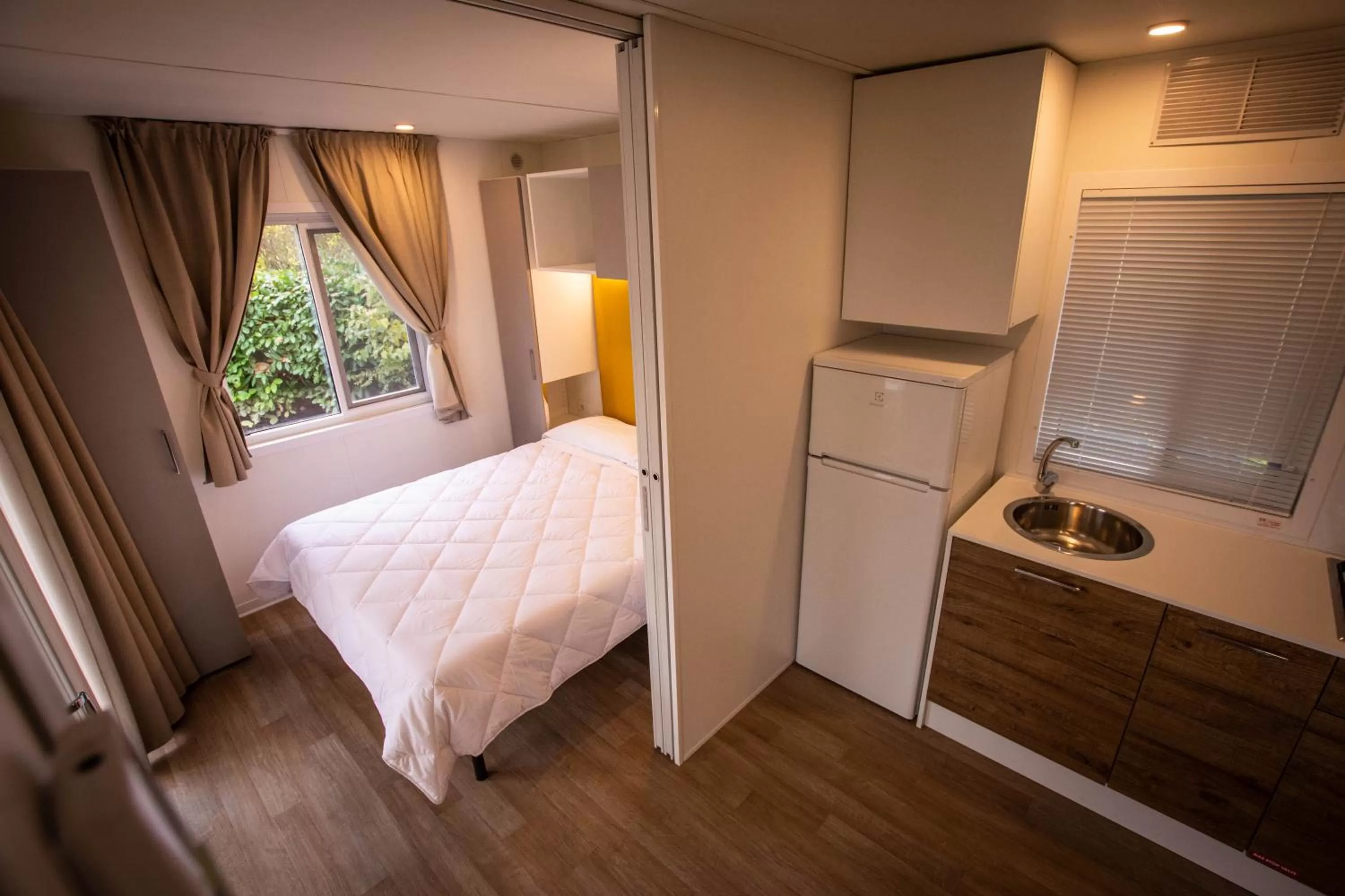 Bed in Albavillage Rooms & Camping