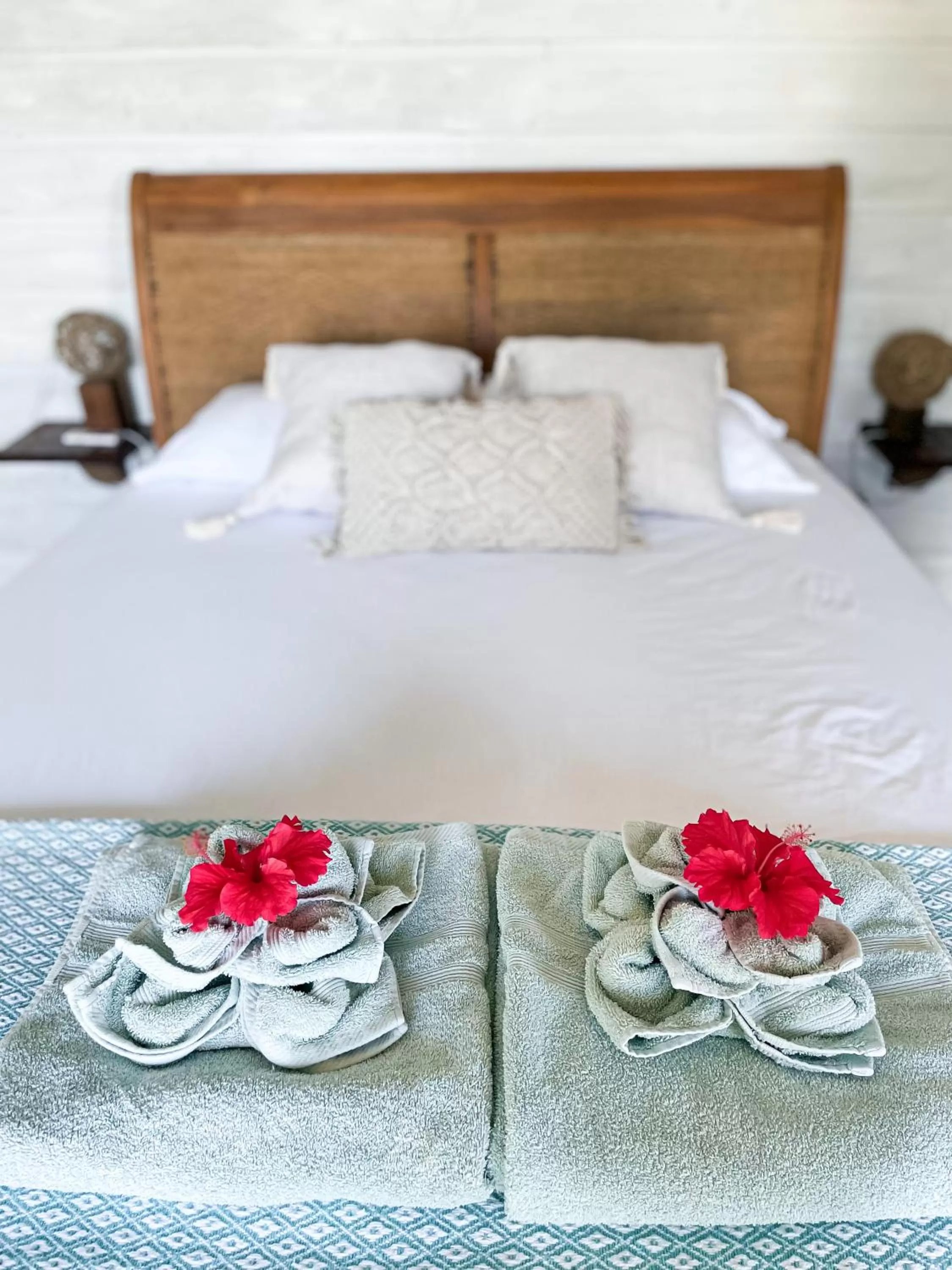 Bed in Bird Island Bungalows