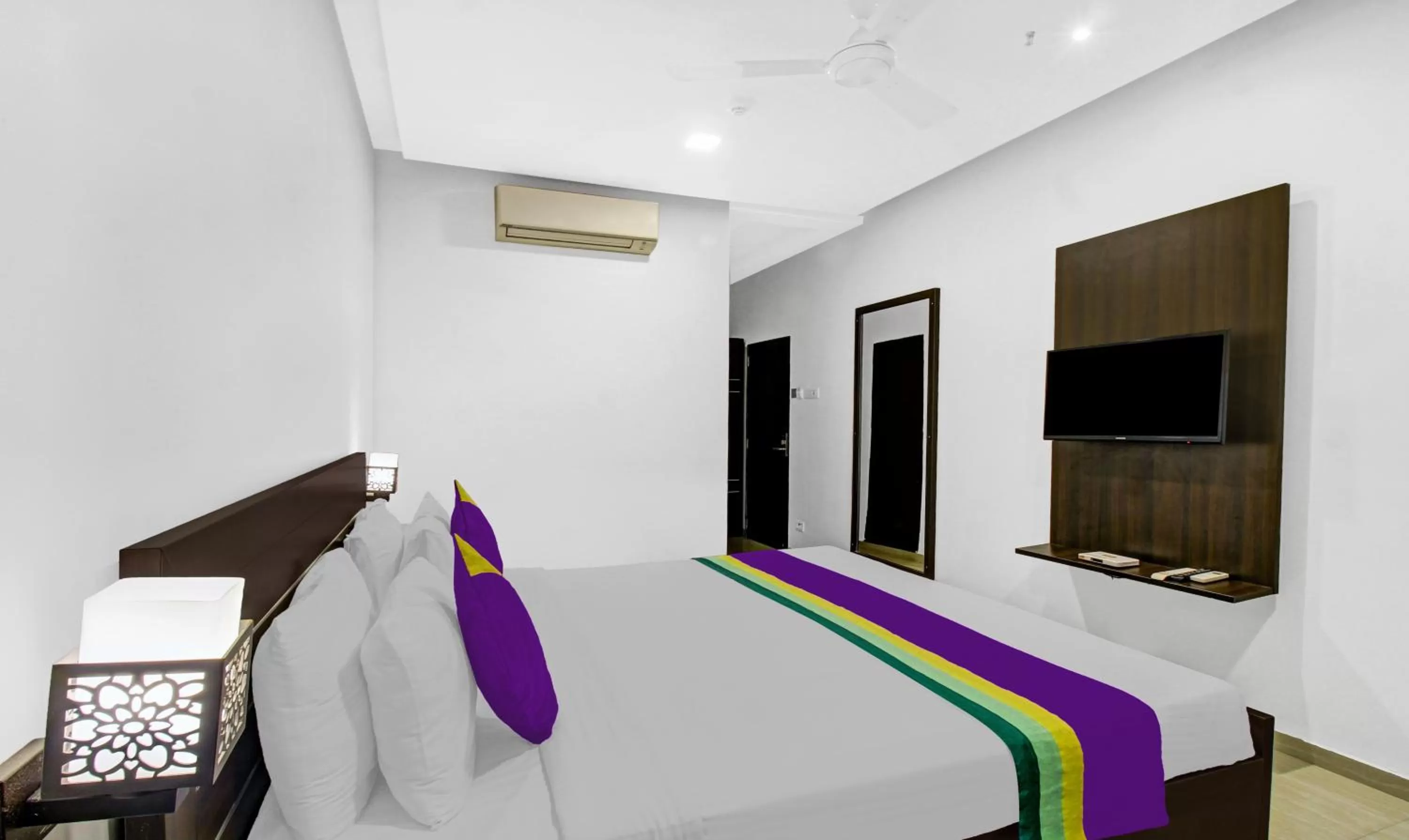 Bedroom, Bed in Treebo Premium Brijinn