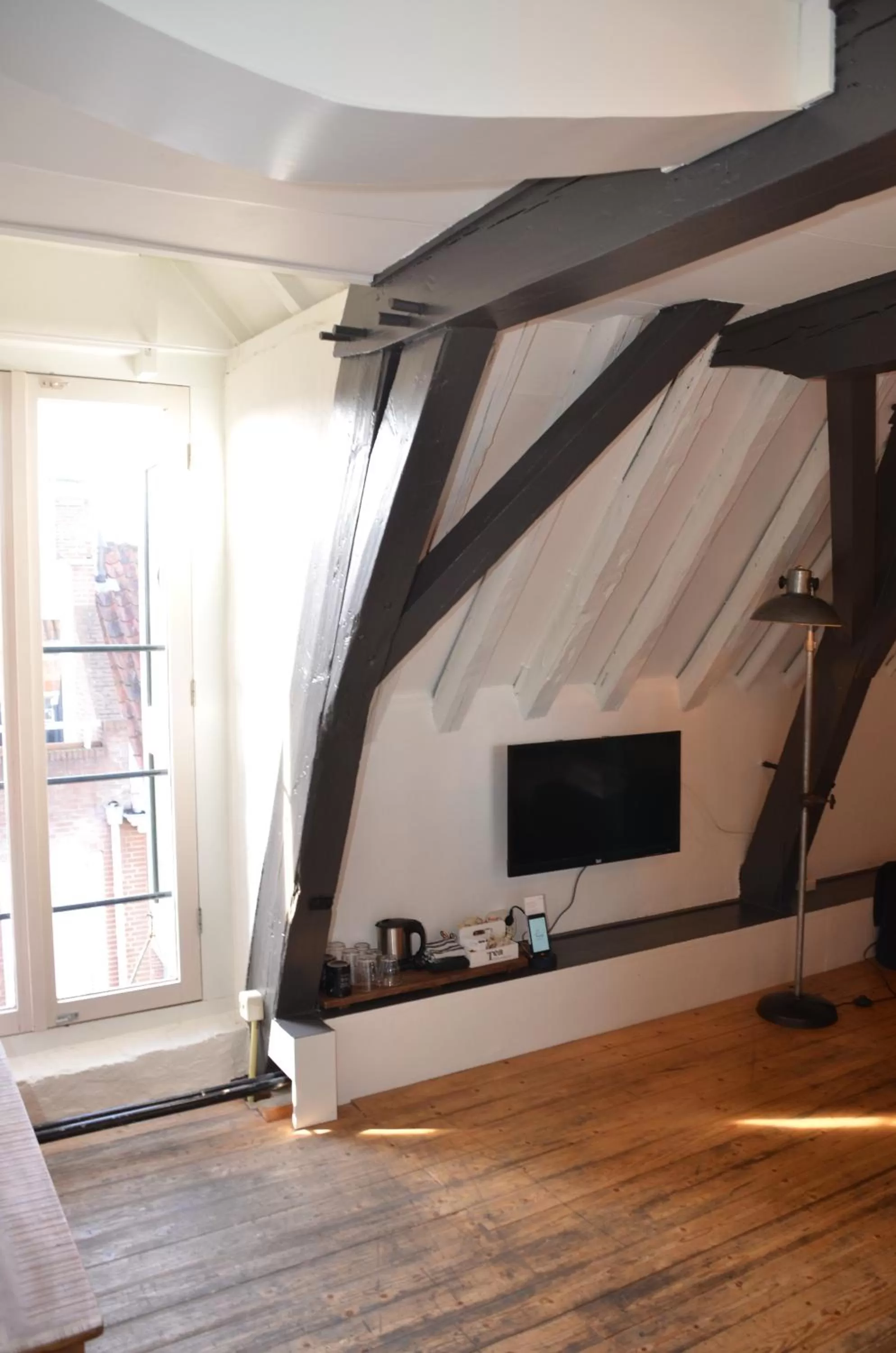 Communal lounge/ TV room in Hotel de Tabaksplant