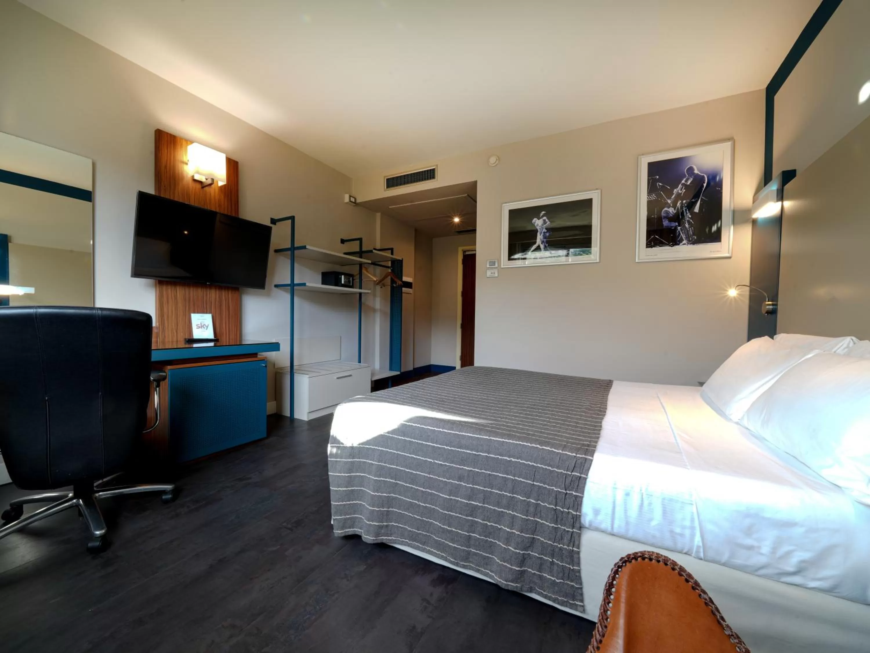 Bed in La Meridiana Bleisure Hotel