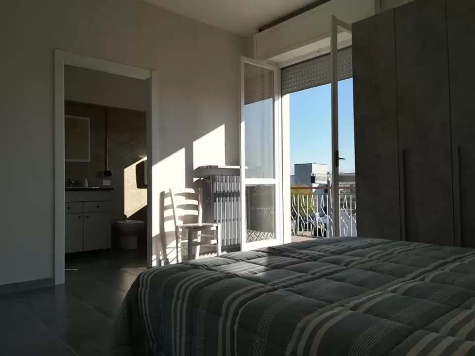 Photo of the whole room, Bed in LE MURA Foresteria