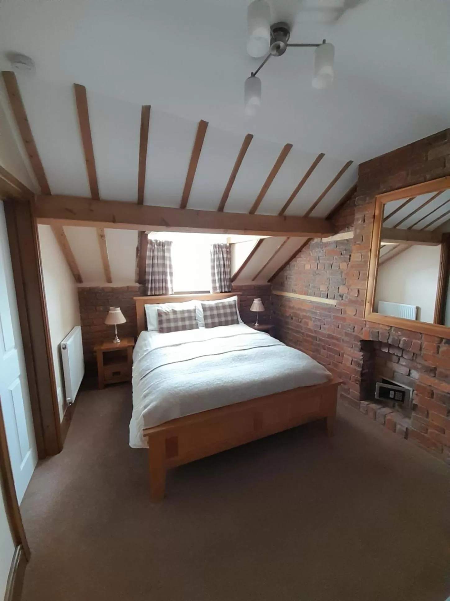 Bed in The Dolfor Inn