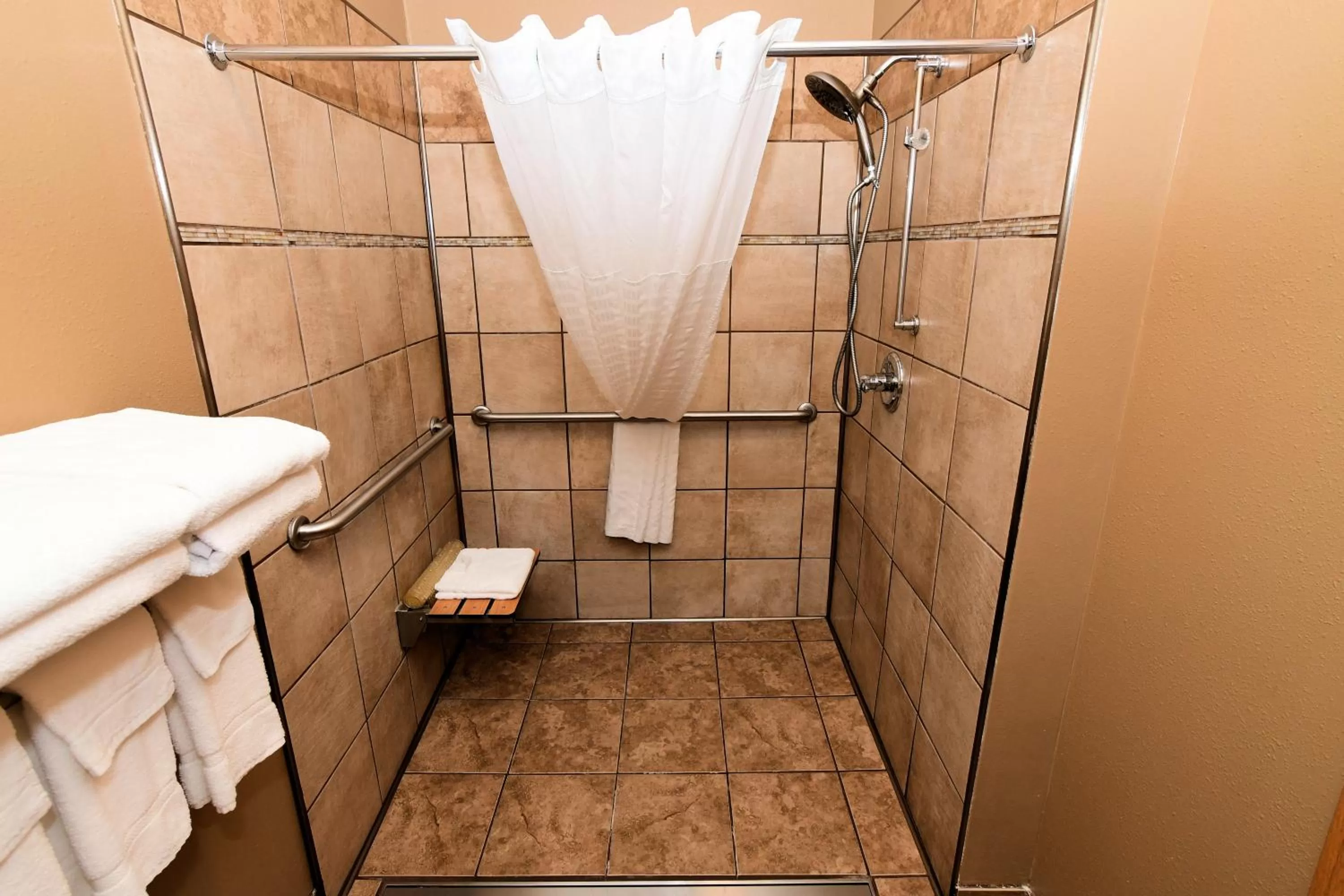 Shower in Cobblestone Inn & Suites - Denison | Majestic Hills