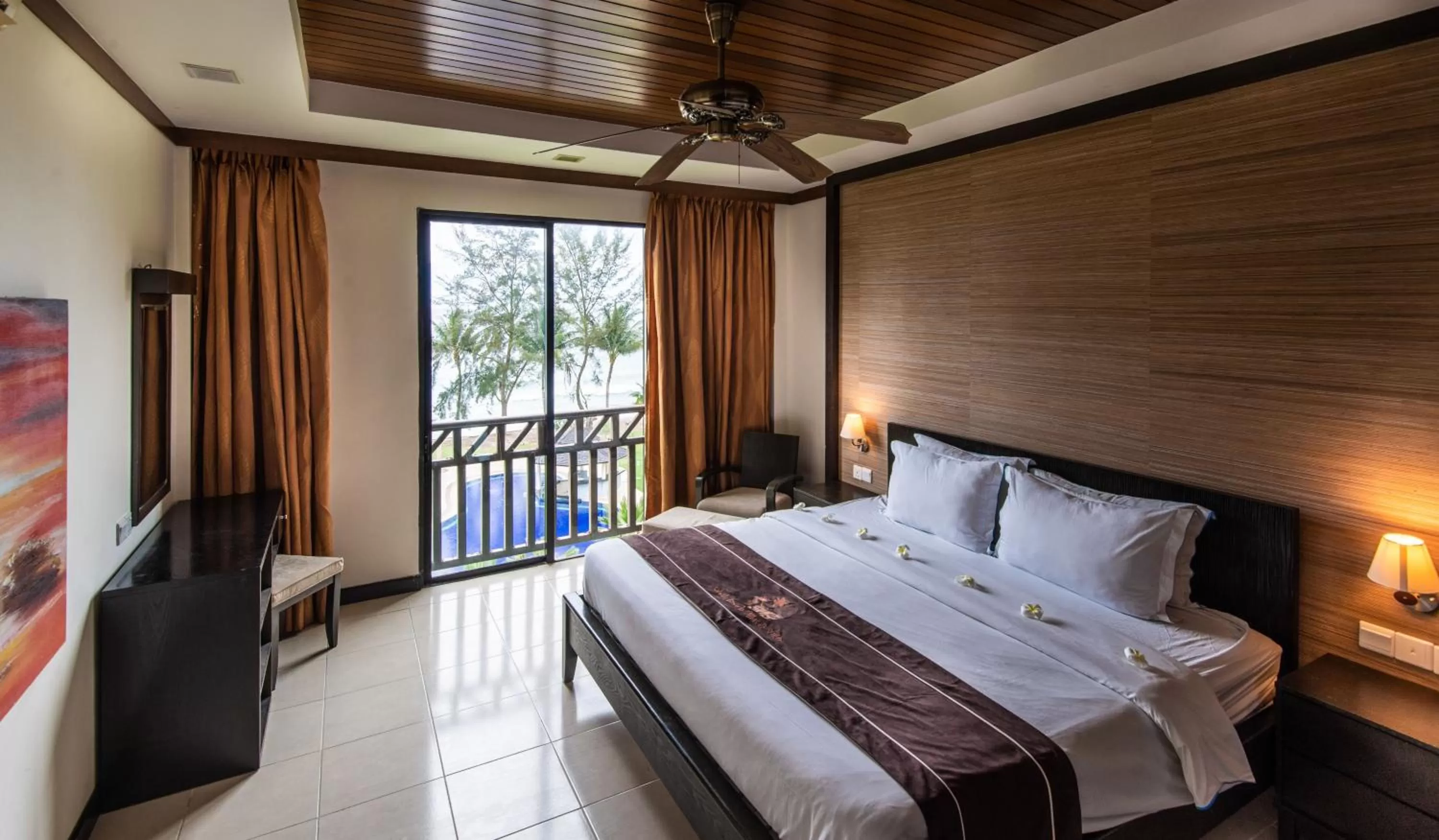 Bed in Sabah Beach Villas & Suites