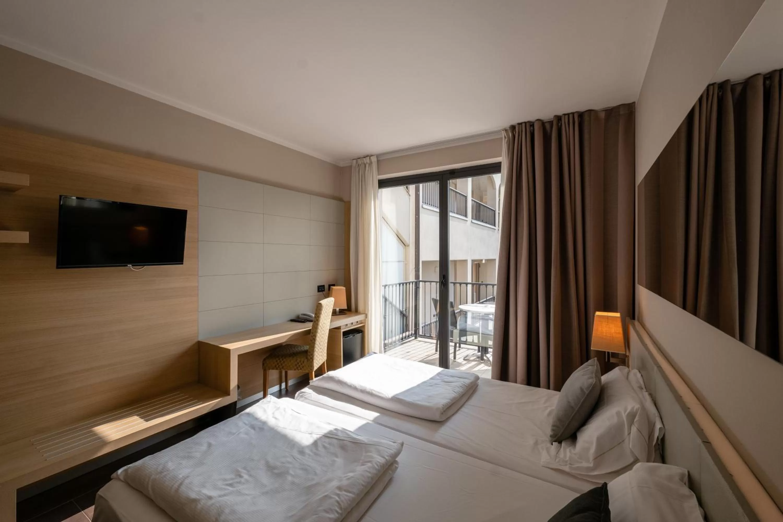 Bed in Villa Luisa Resort & Luxury Apartments