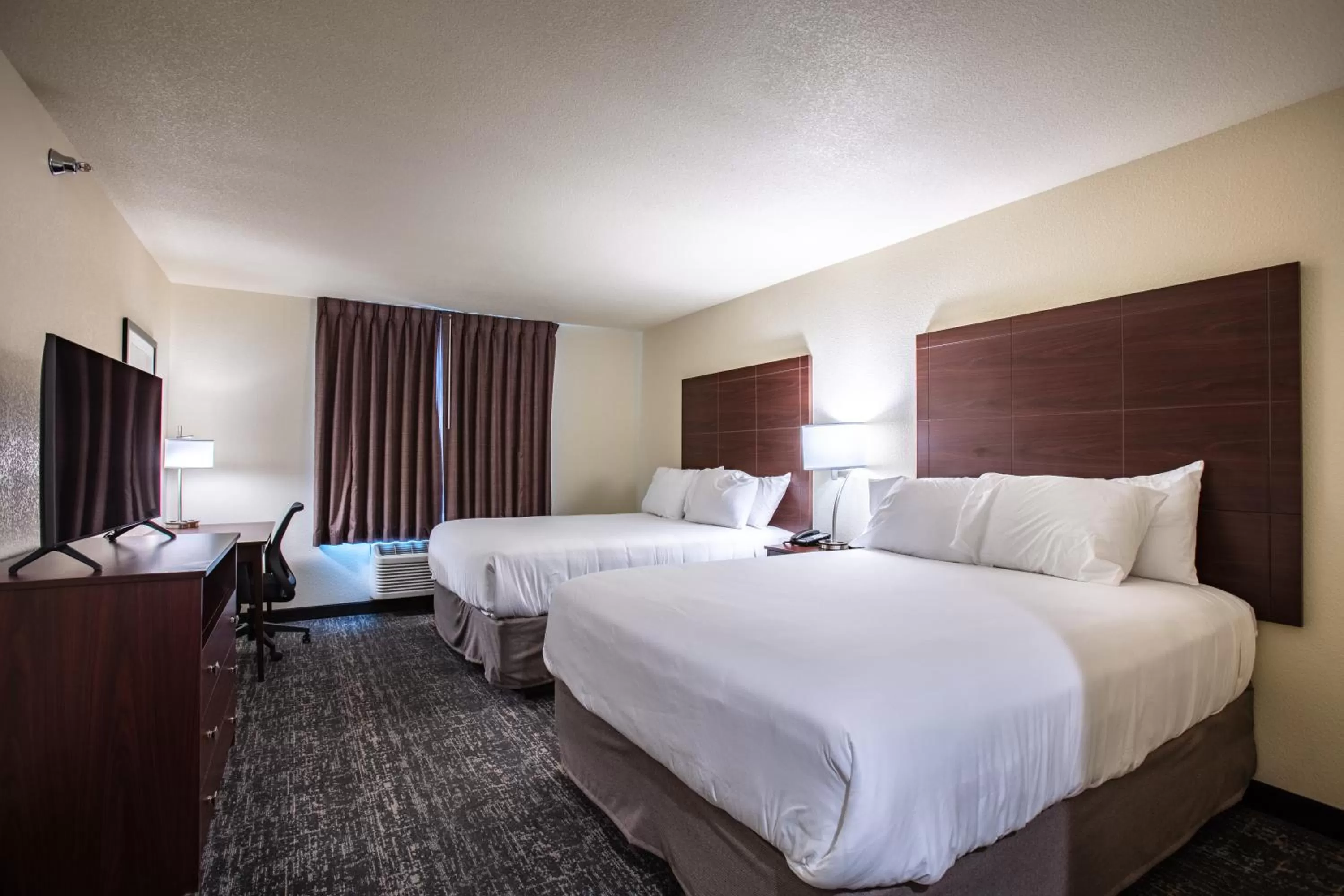 Bed in Cobblestone Inn & Suites - Pine Bluffs