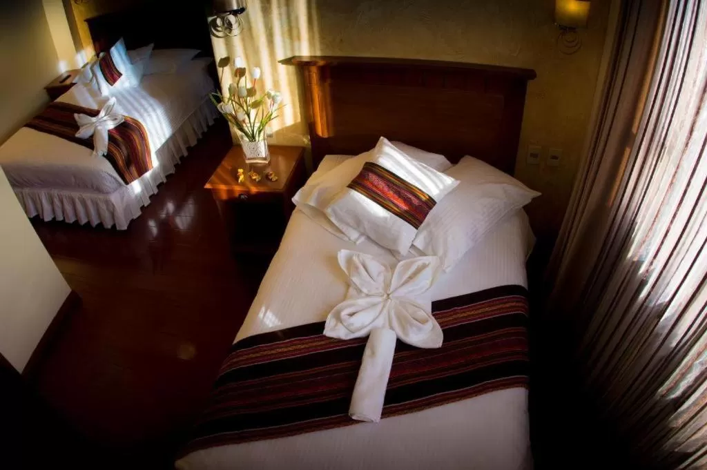 Photo of the whole room, Bed in Qantu Hotel