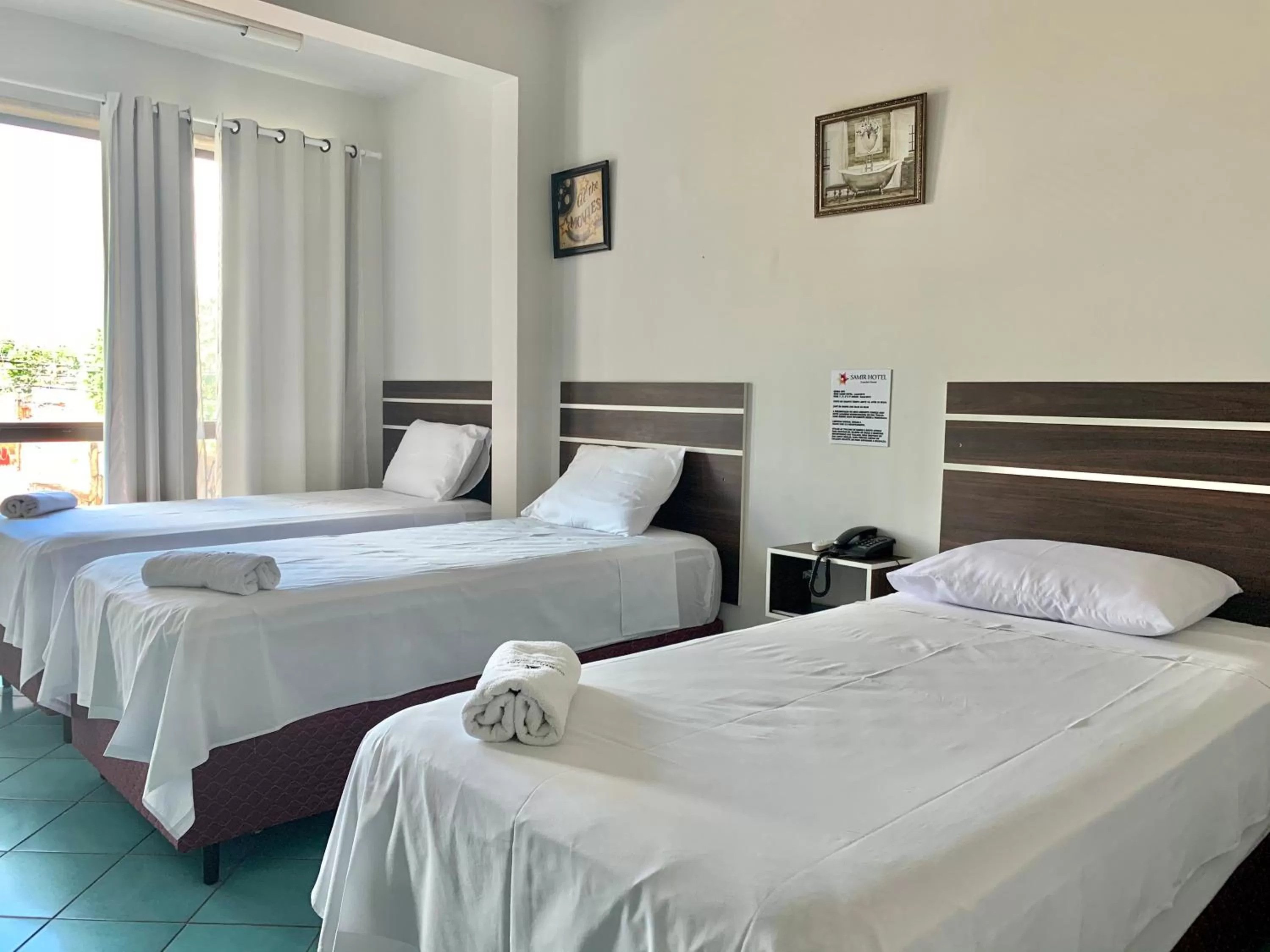 Bed in SAMIR HOTEL COMFORT