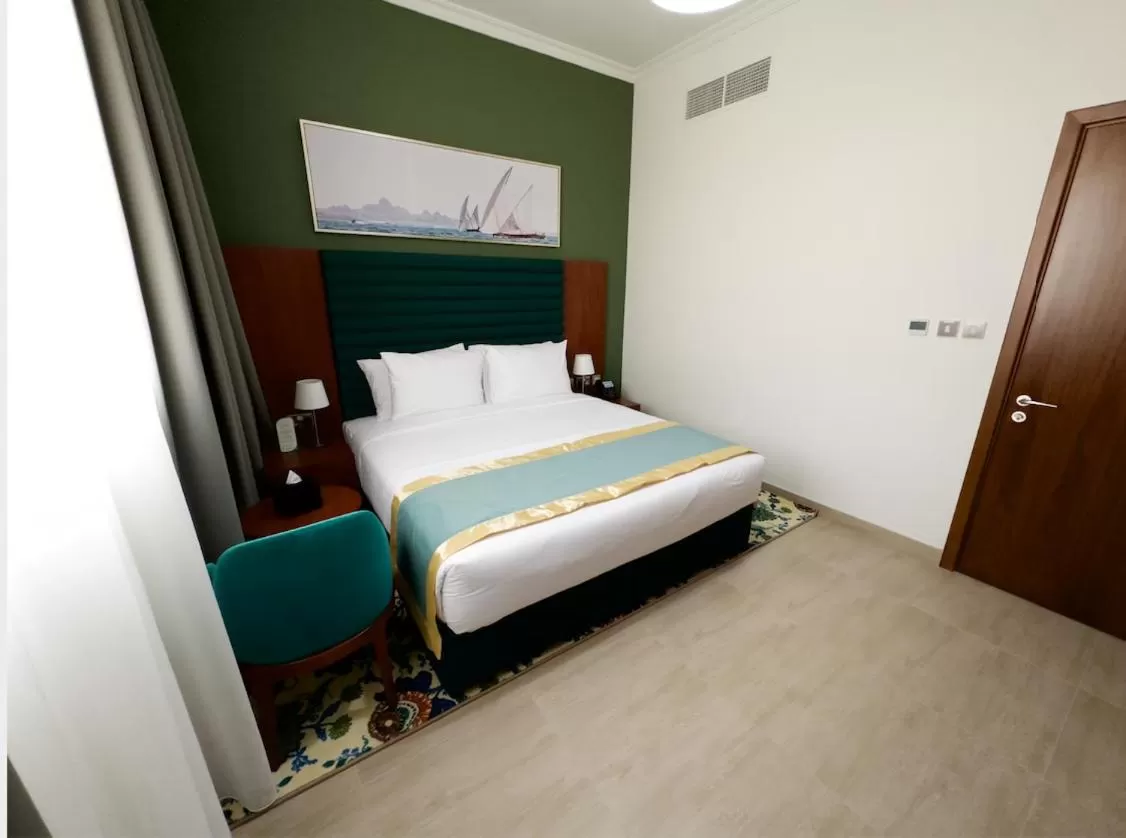 Bed in BANIYAS PLAZA HOTEL APARTMENTS