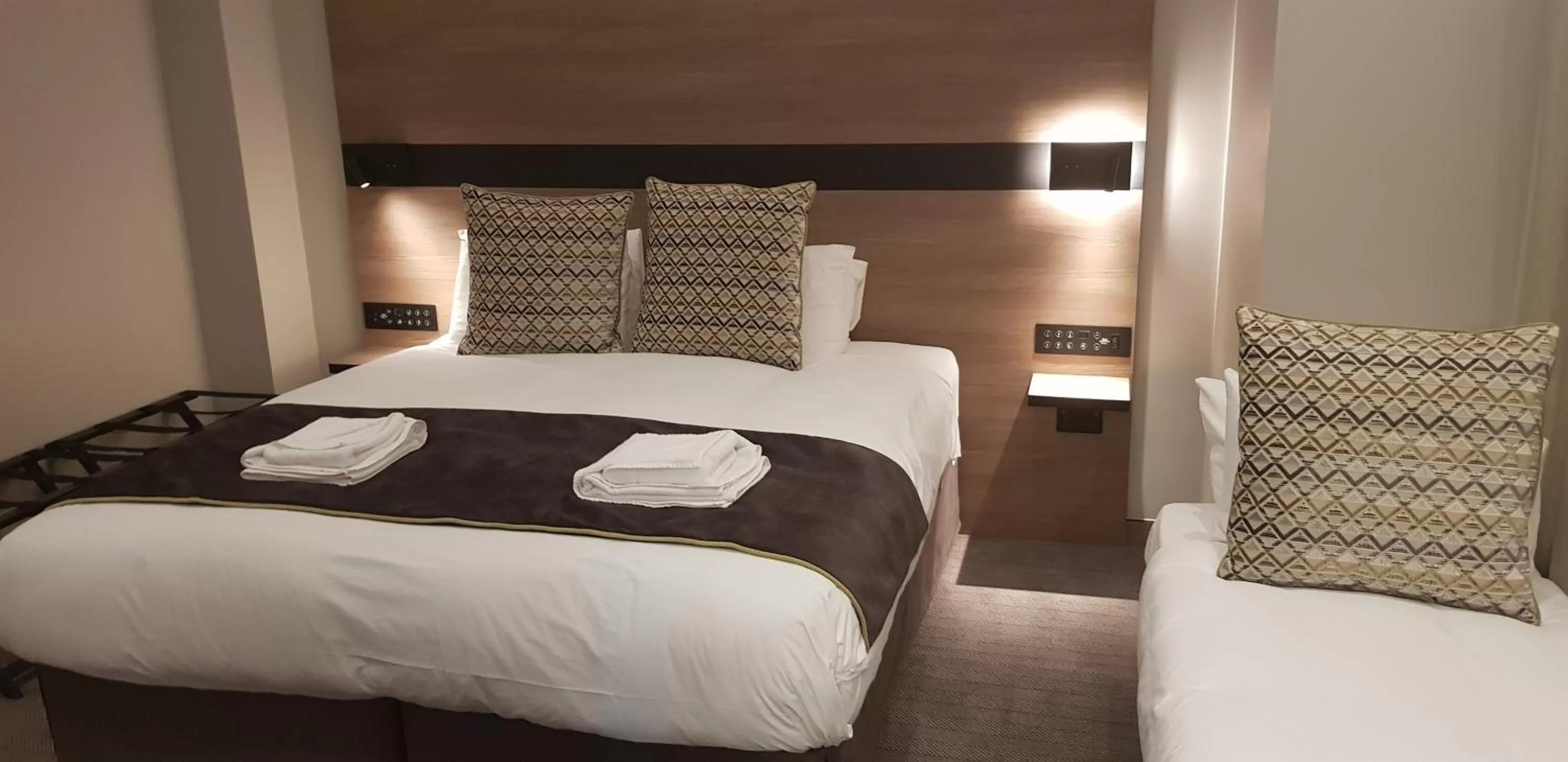 Bed in Merit Kensington Hotel