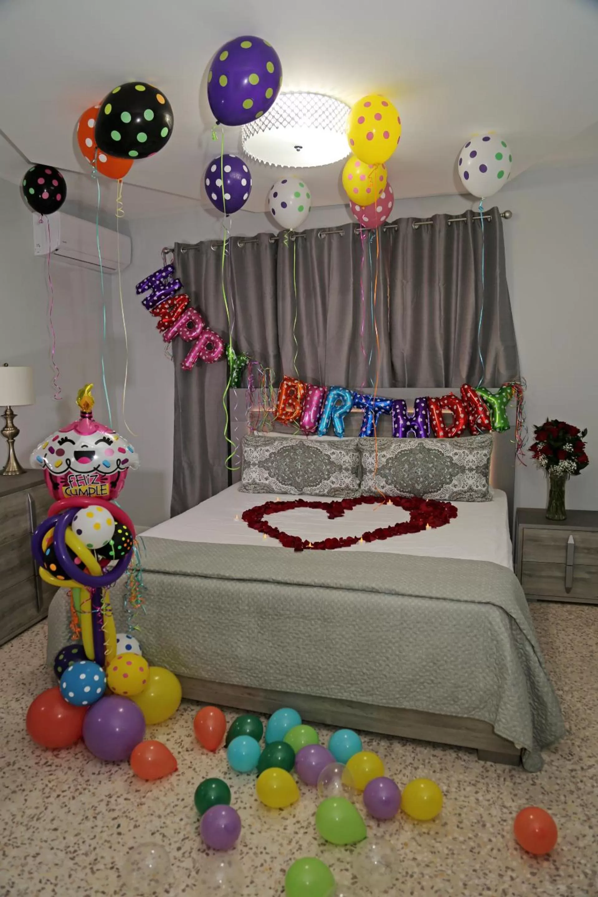 Bed in Itza-Bella Suites