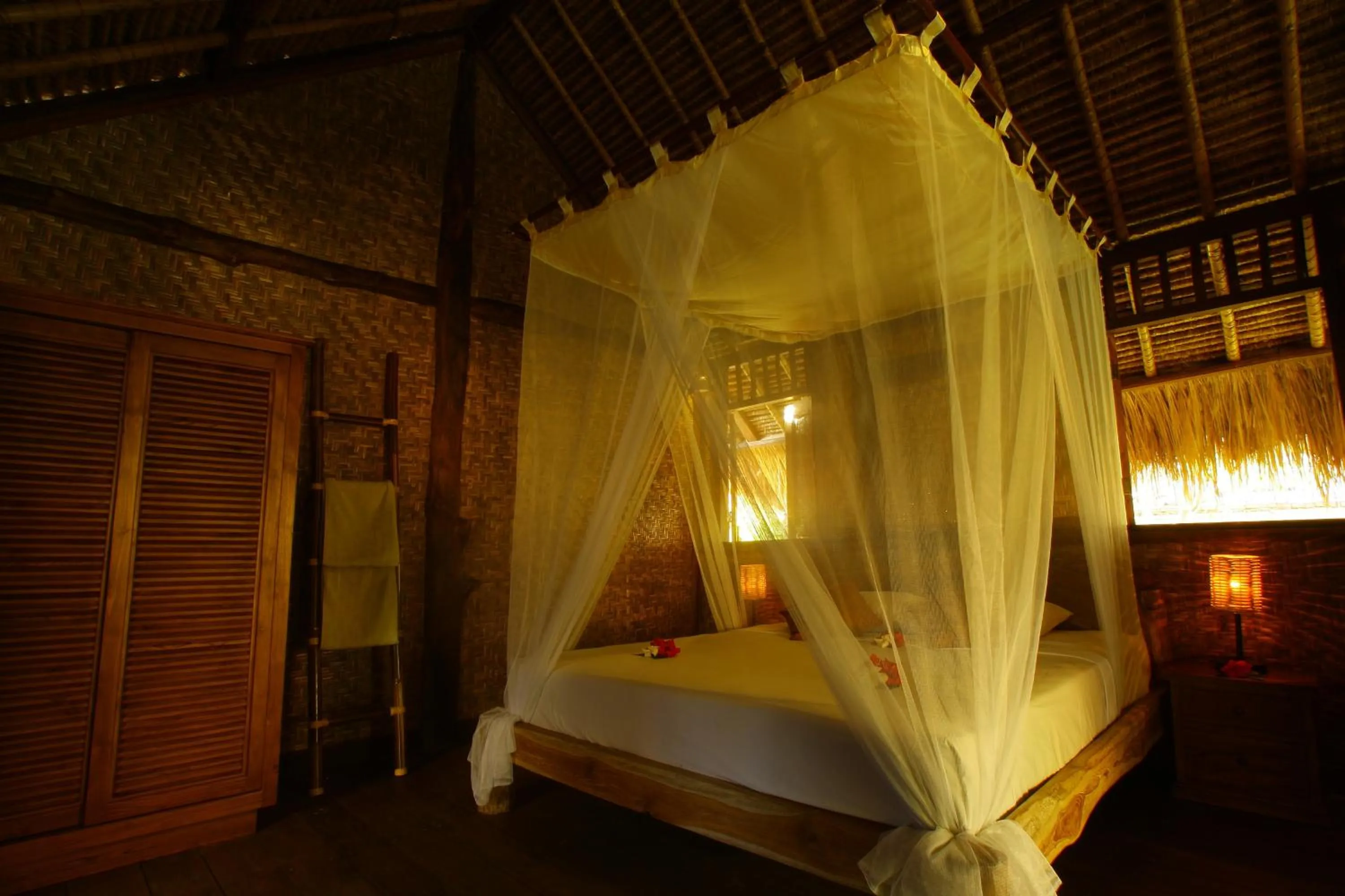 Bed in Flower Bud Bungalow Balangan