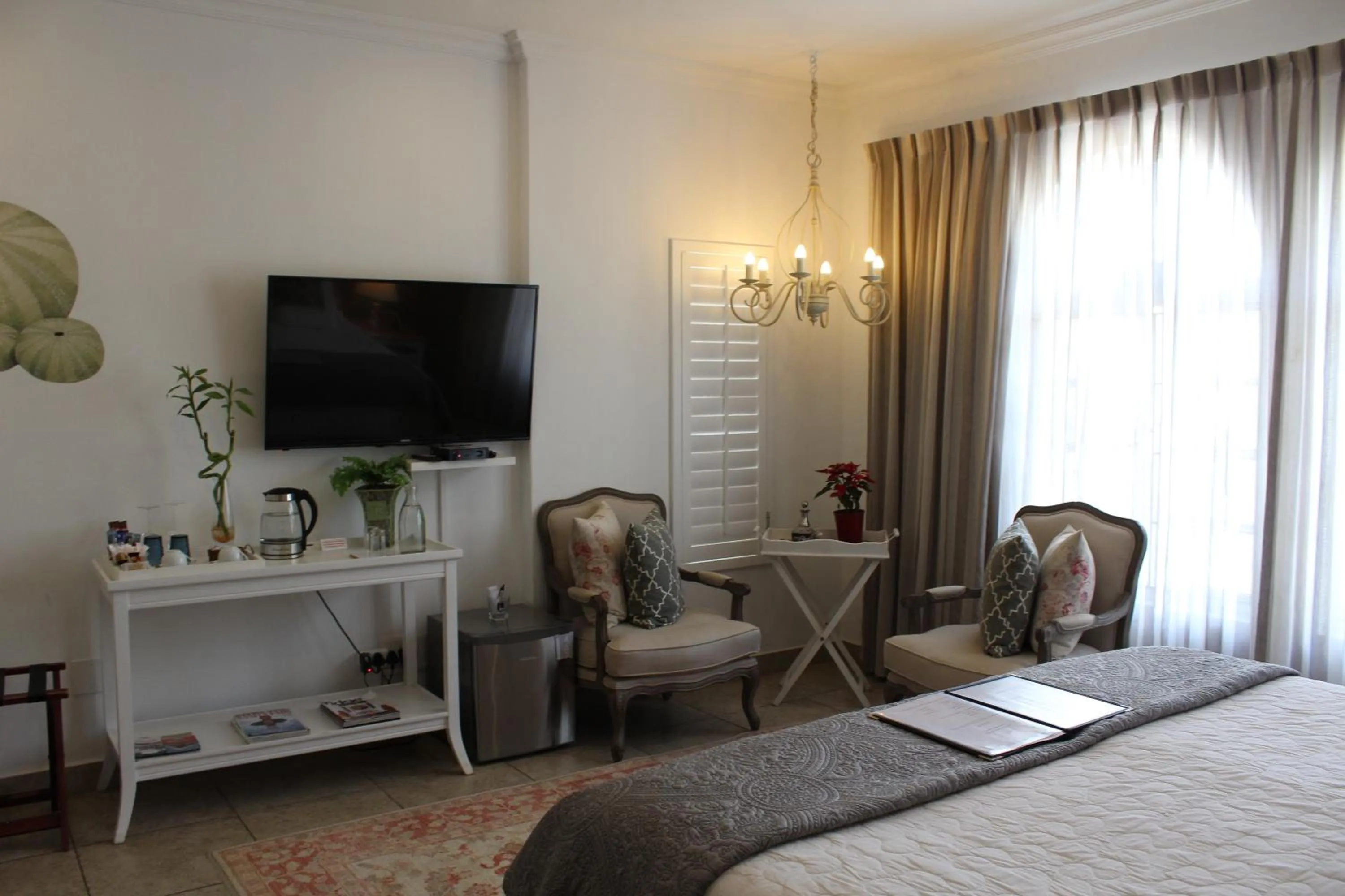 Seating area, Bed in Sandals Guest House