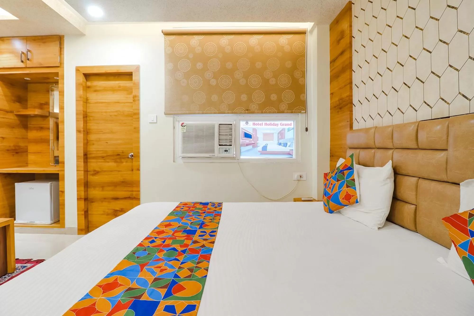 Bed in FabHotel Holiday Grand