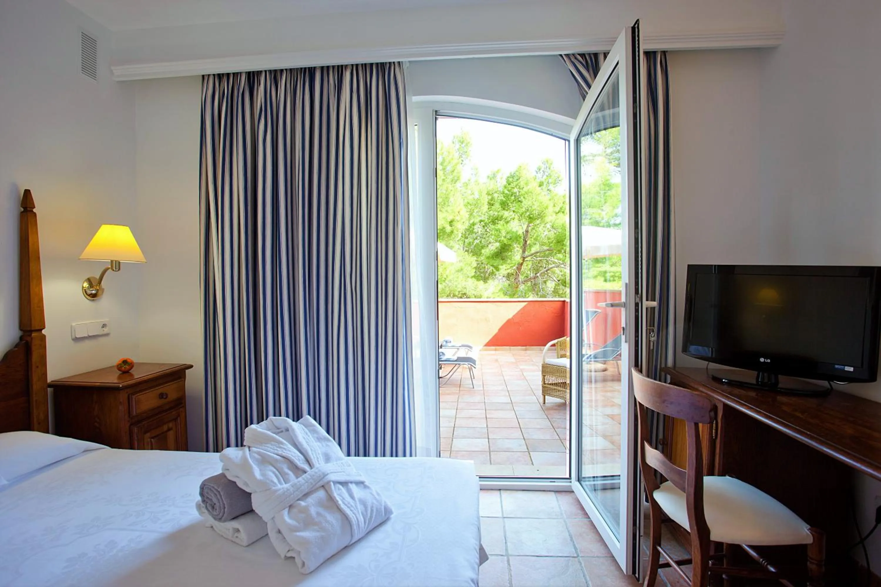 Photo of the whole room, Bed in Hotel Cala Sant Vicenç - Adults Only