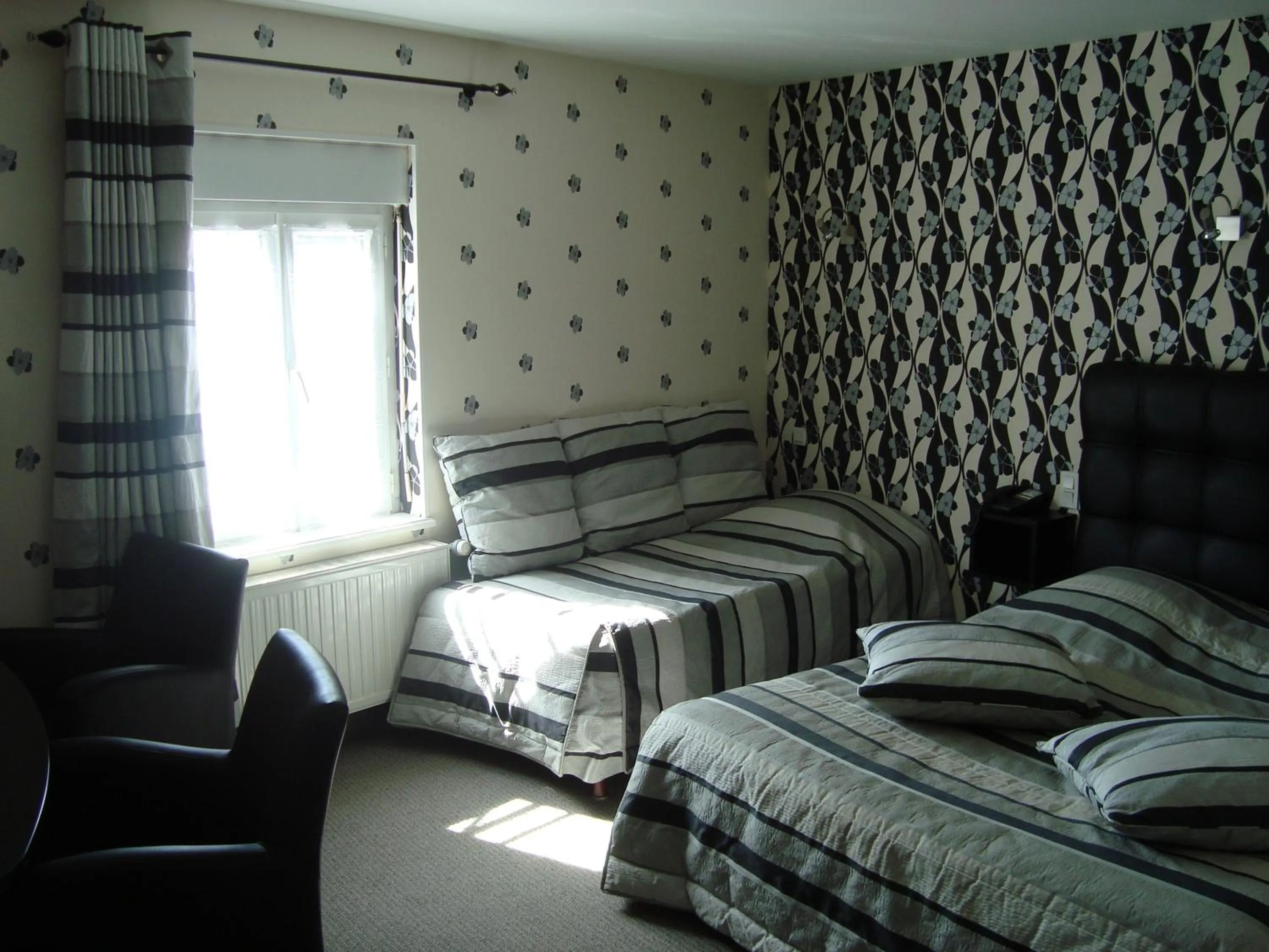 Photo of the whole room, Bed in Hôtel de La Croix d'Or