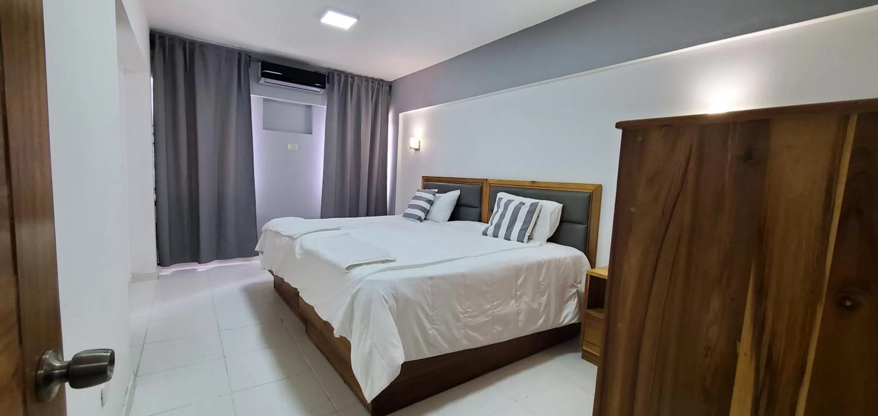 Bed in Boca Grande Hotel Suites