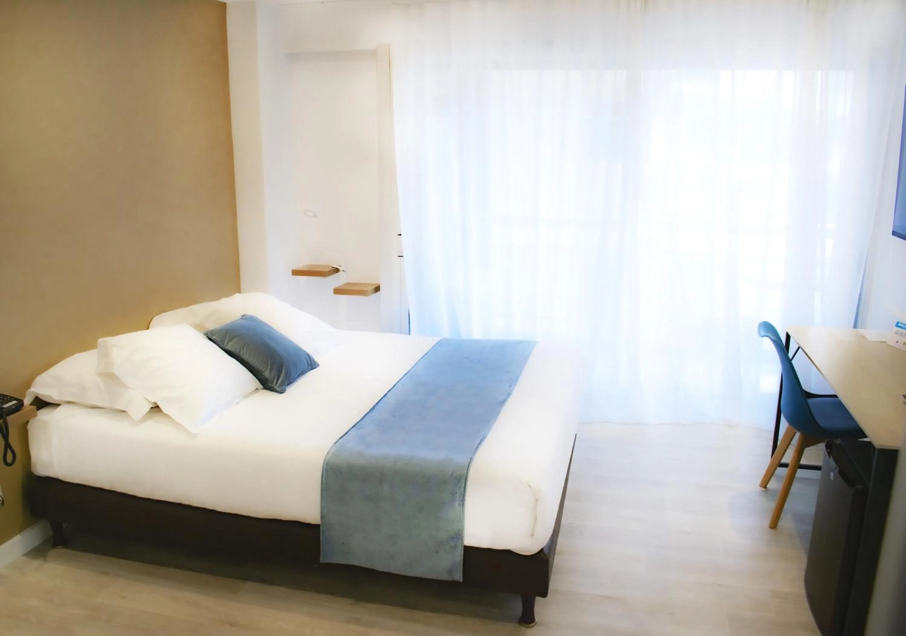 Bed in Tiercé Hotel