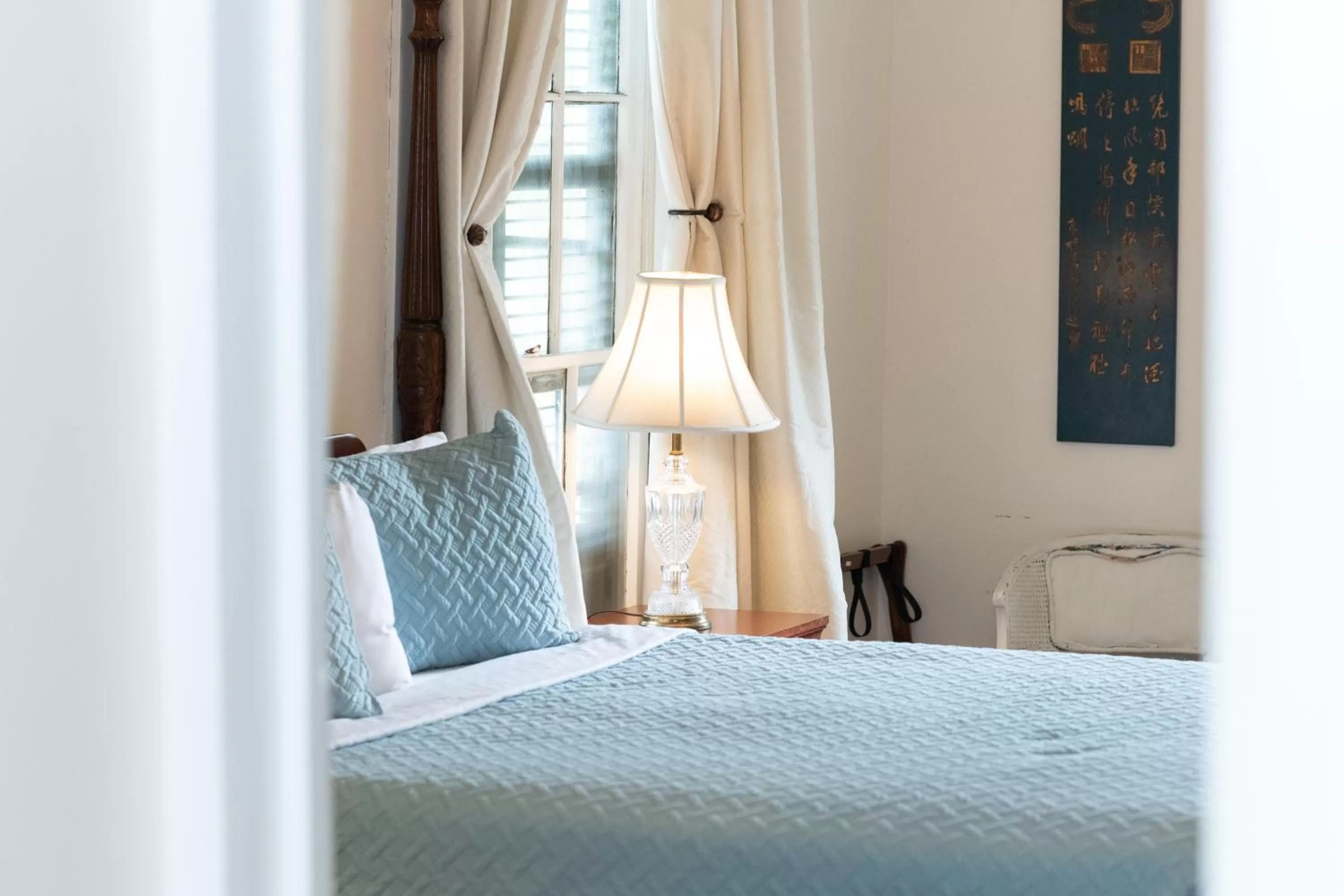 Bed in The Esplanade Guesthouse Mansion