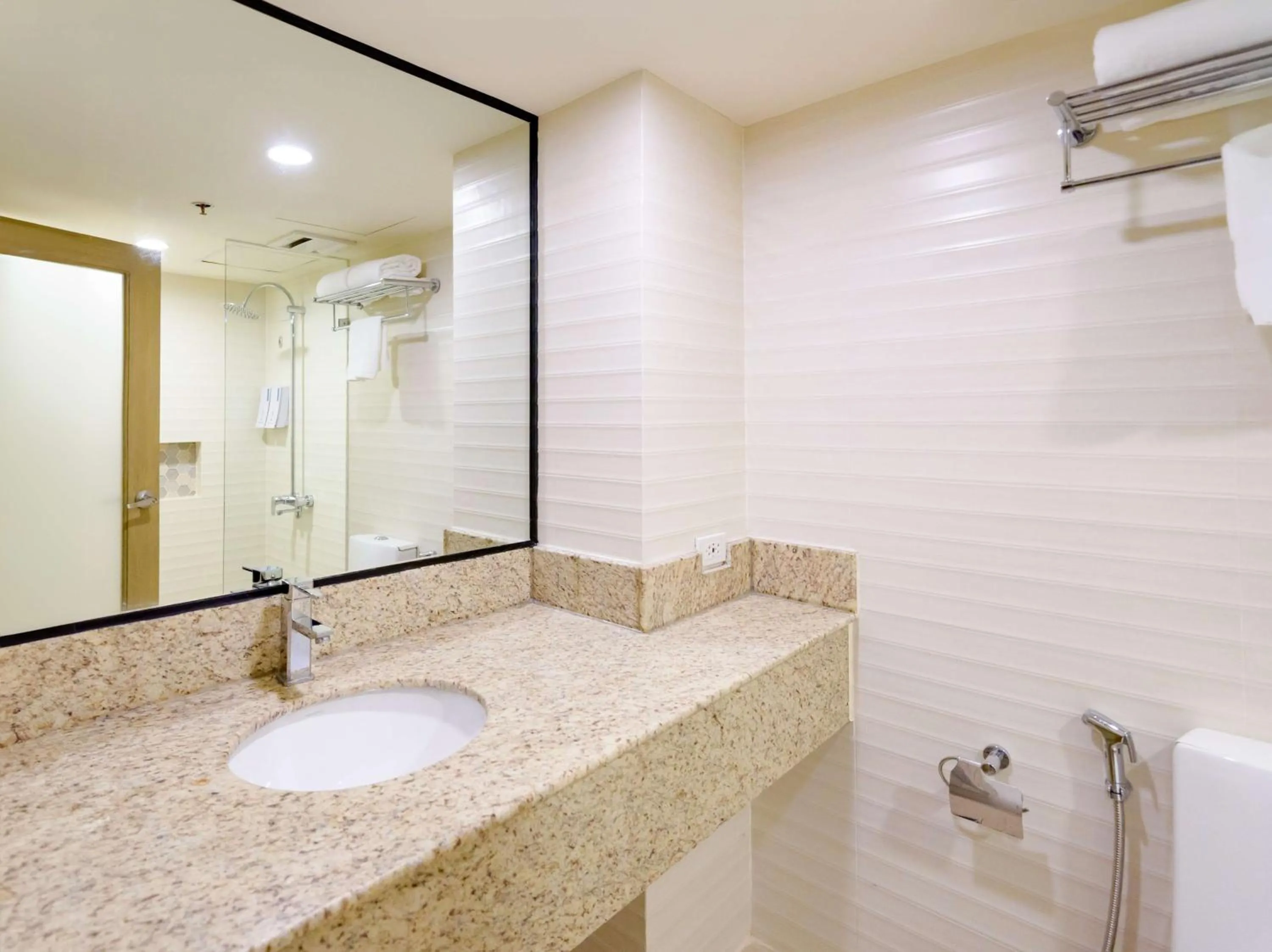 Bathroom in SureStay Plus by Best Western Cebu City