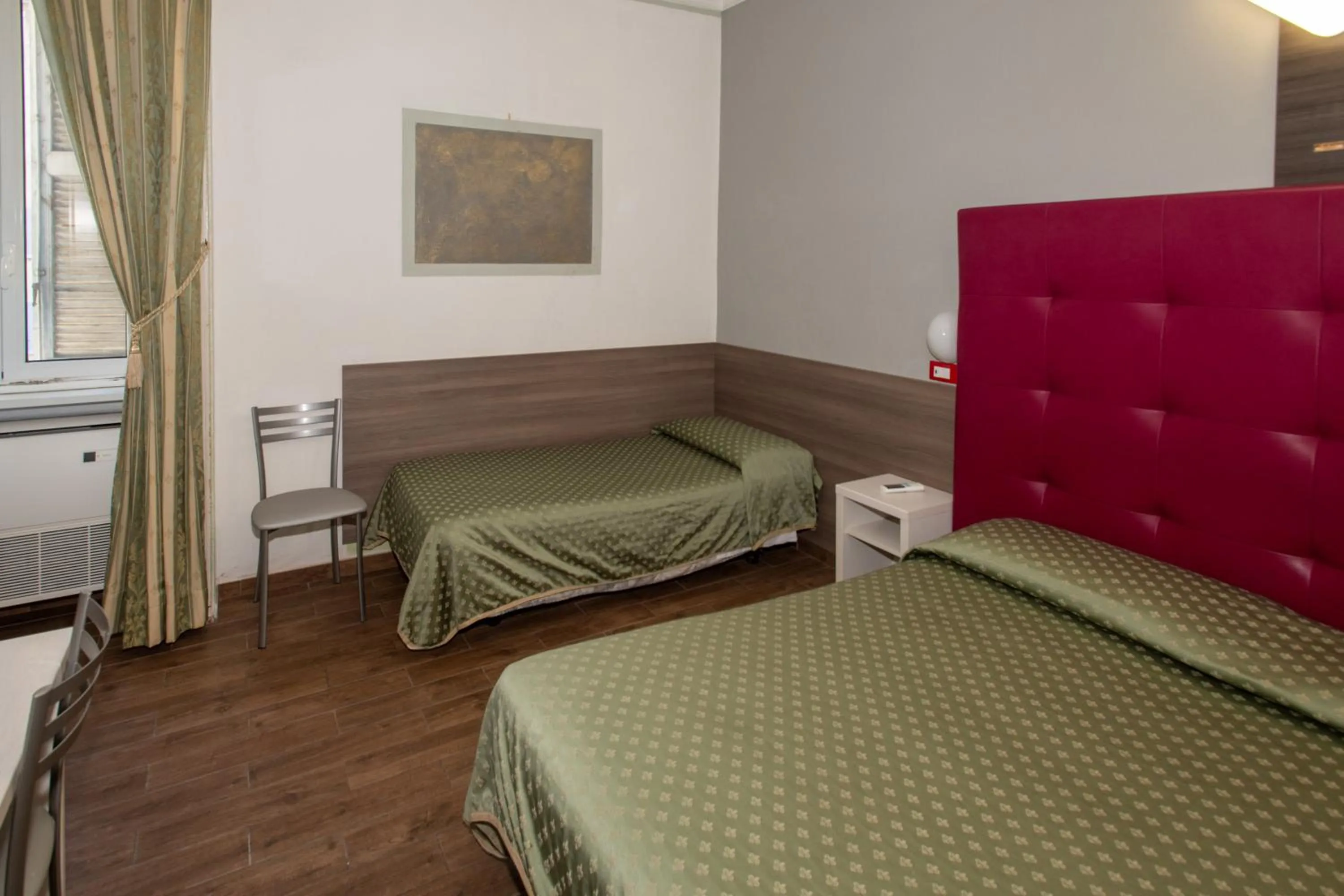 Bed in Hotel Piola