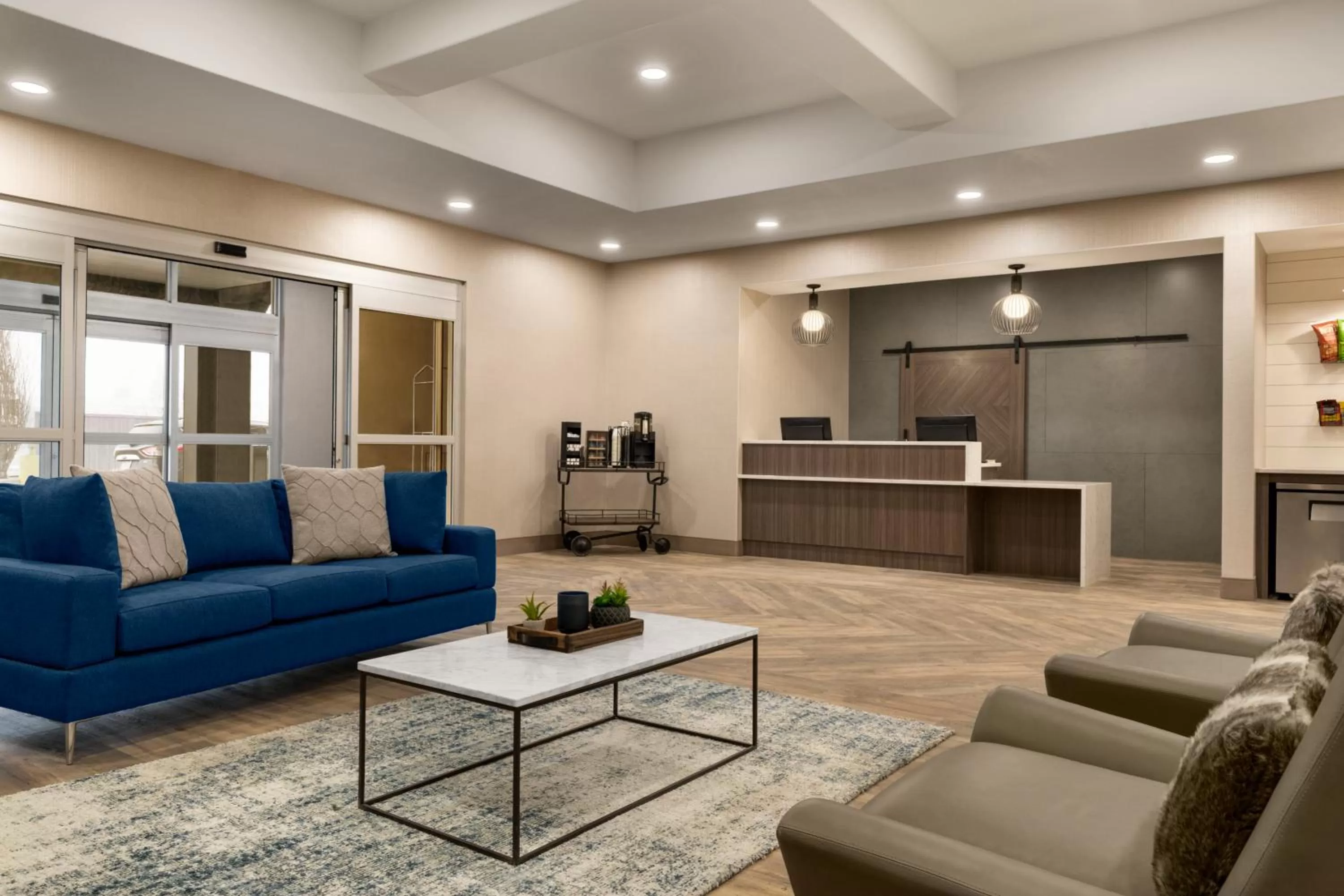 Lobby or reception in Ramada by Wyndham Airdrie Hotel & Suites