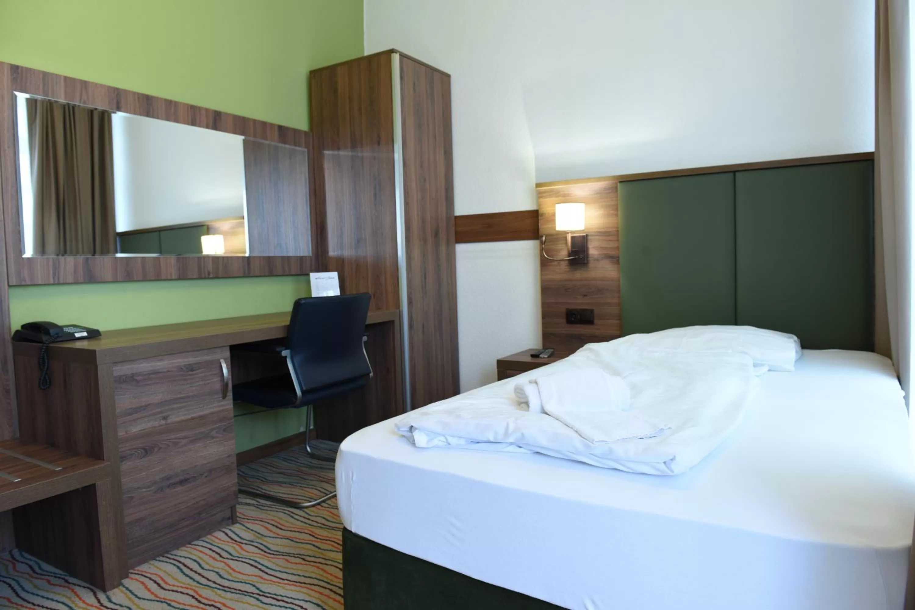 Bed in Hotel Olive Inn