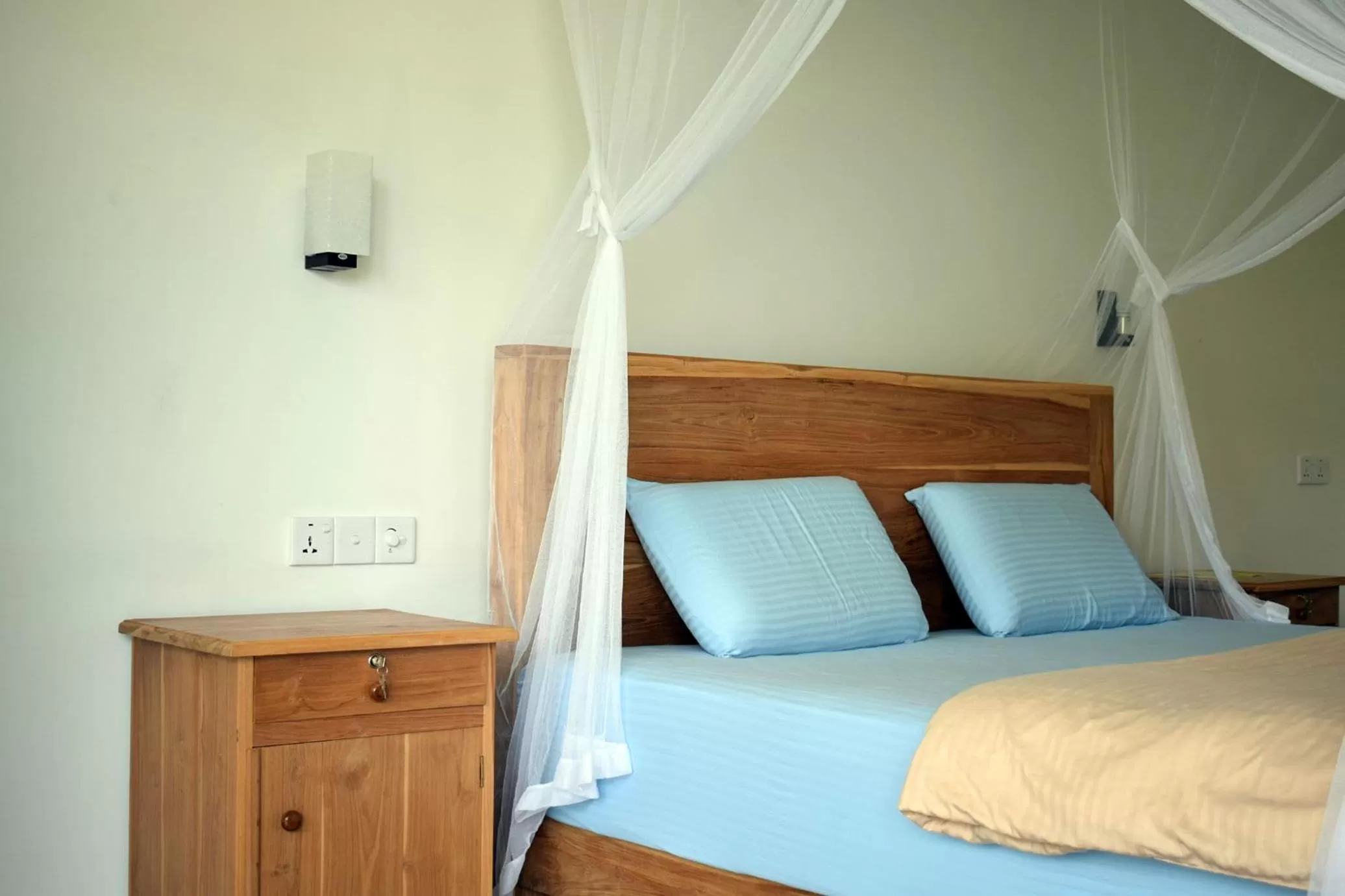 Bed in Raveena Guest House