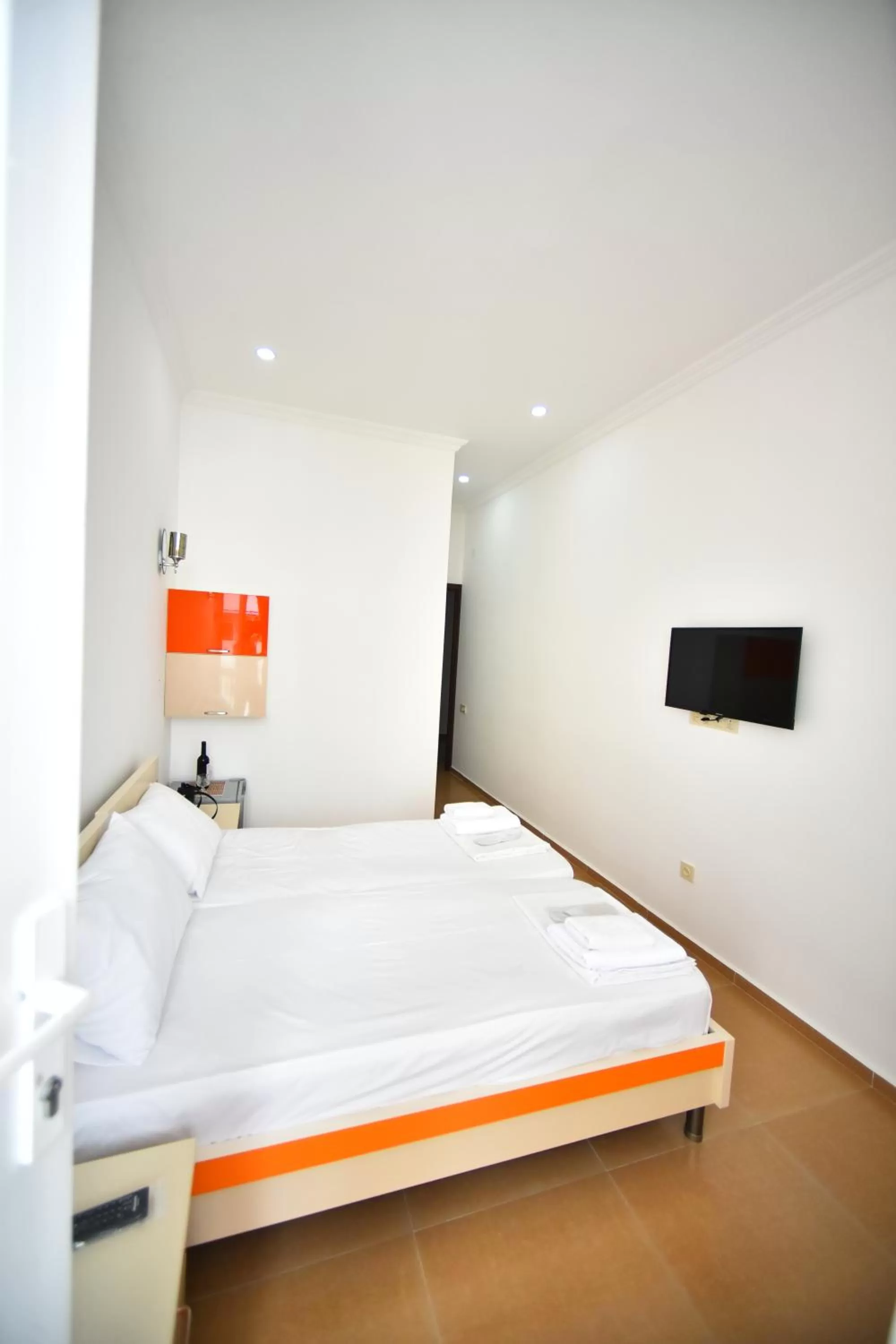 Bed in Orange Home Hotel