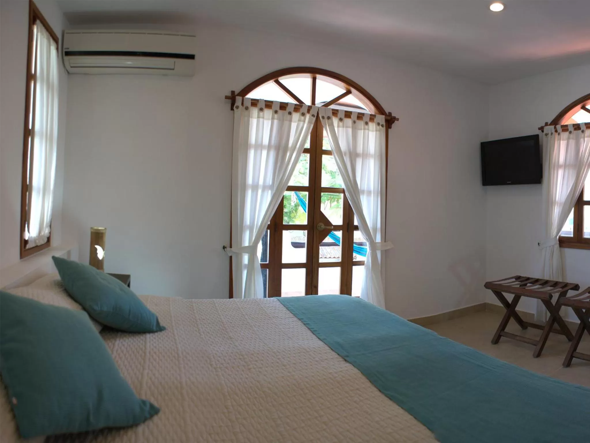 Bed in Hotel Galapagos Suites B&B