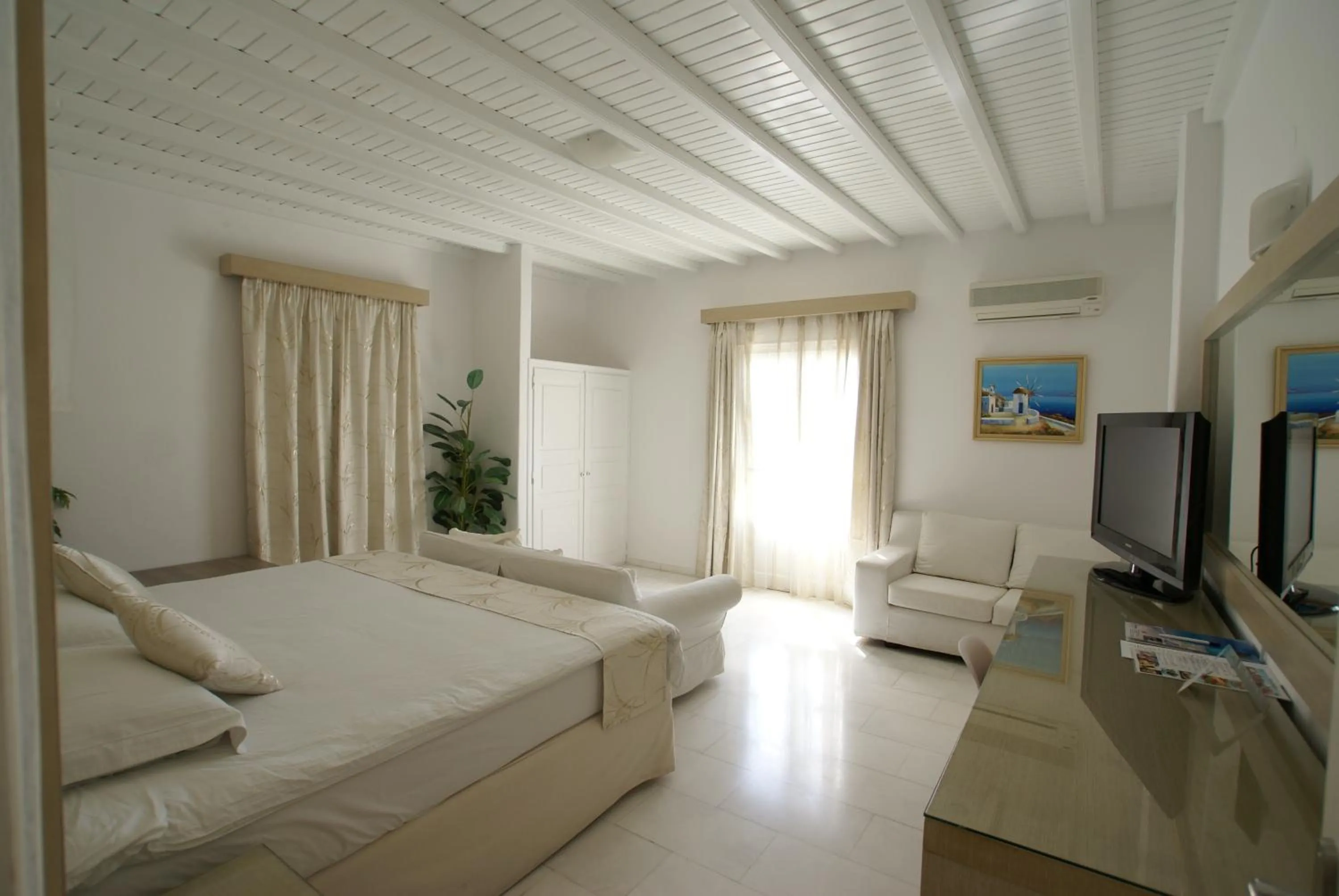 TV and multimedia, Bed in Dionysos Luxury Hotel Mykonos