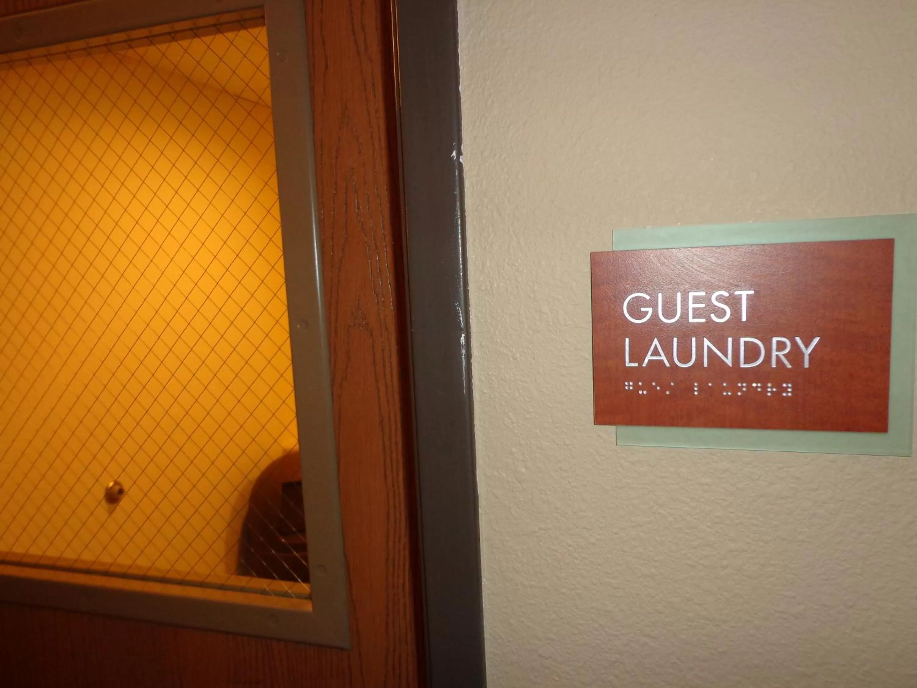 washing machine in AmericInn by Wyndham Grand Forks