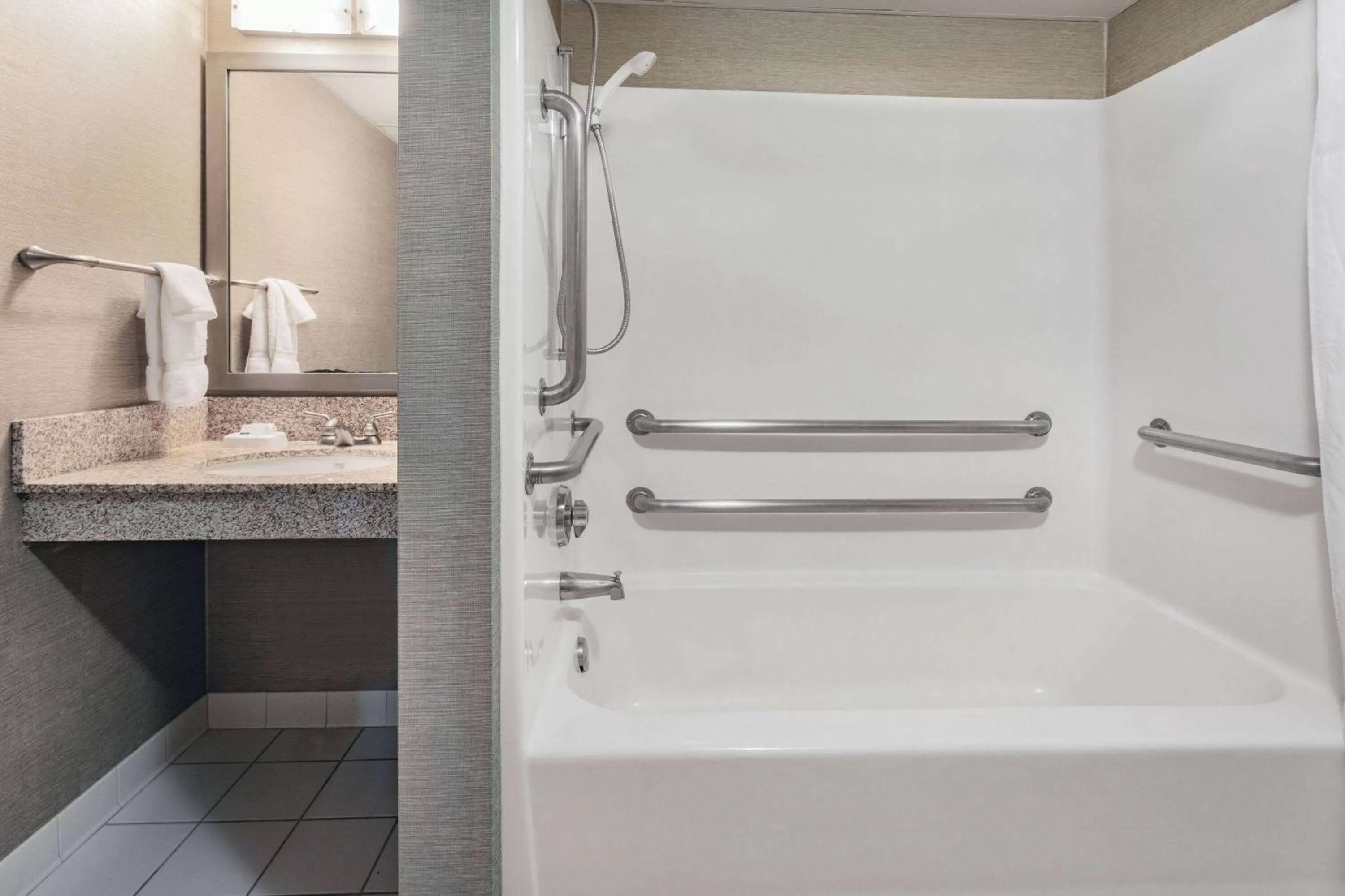 Bathroom in Baymont by Wyndham Brooklyn Center