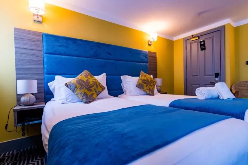 Bed in Stonecross Manor Hotel