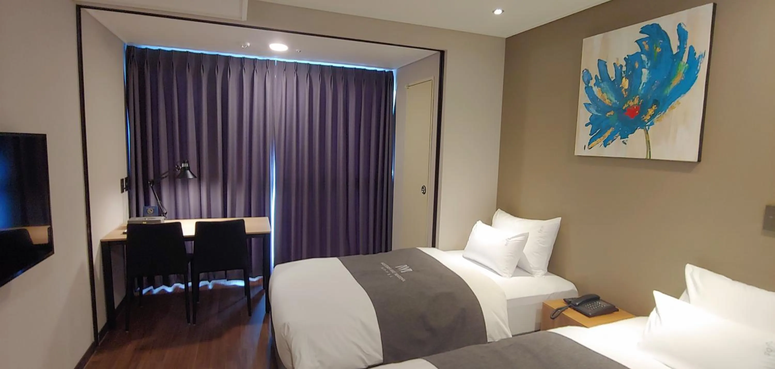 Bed in Western Bay Marina Hotel