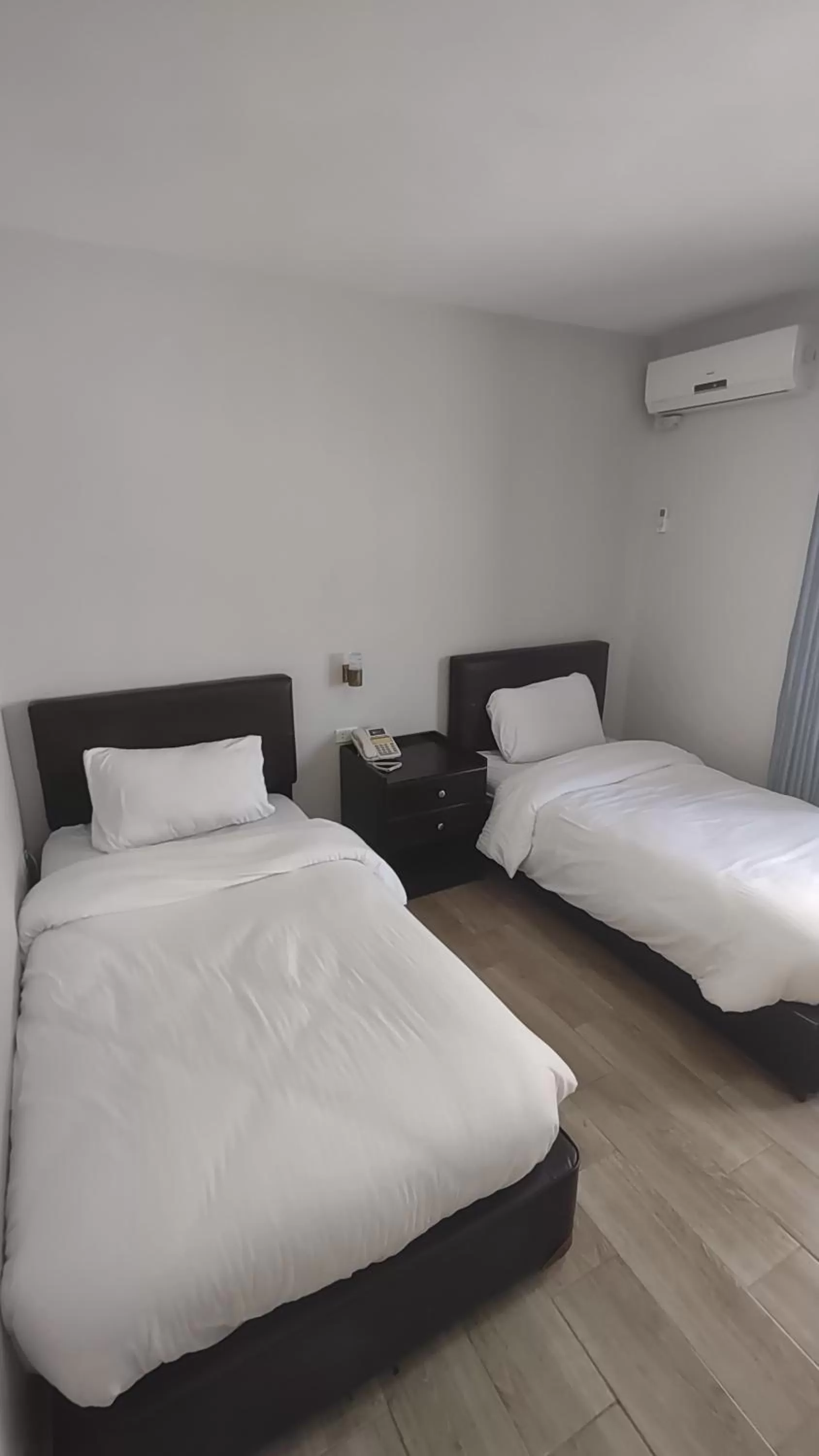 Bed in Black Iris Hotel