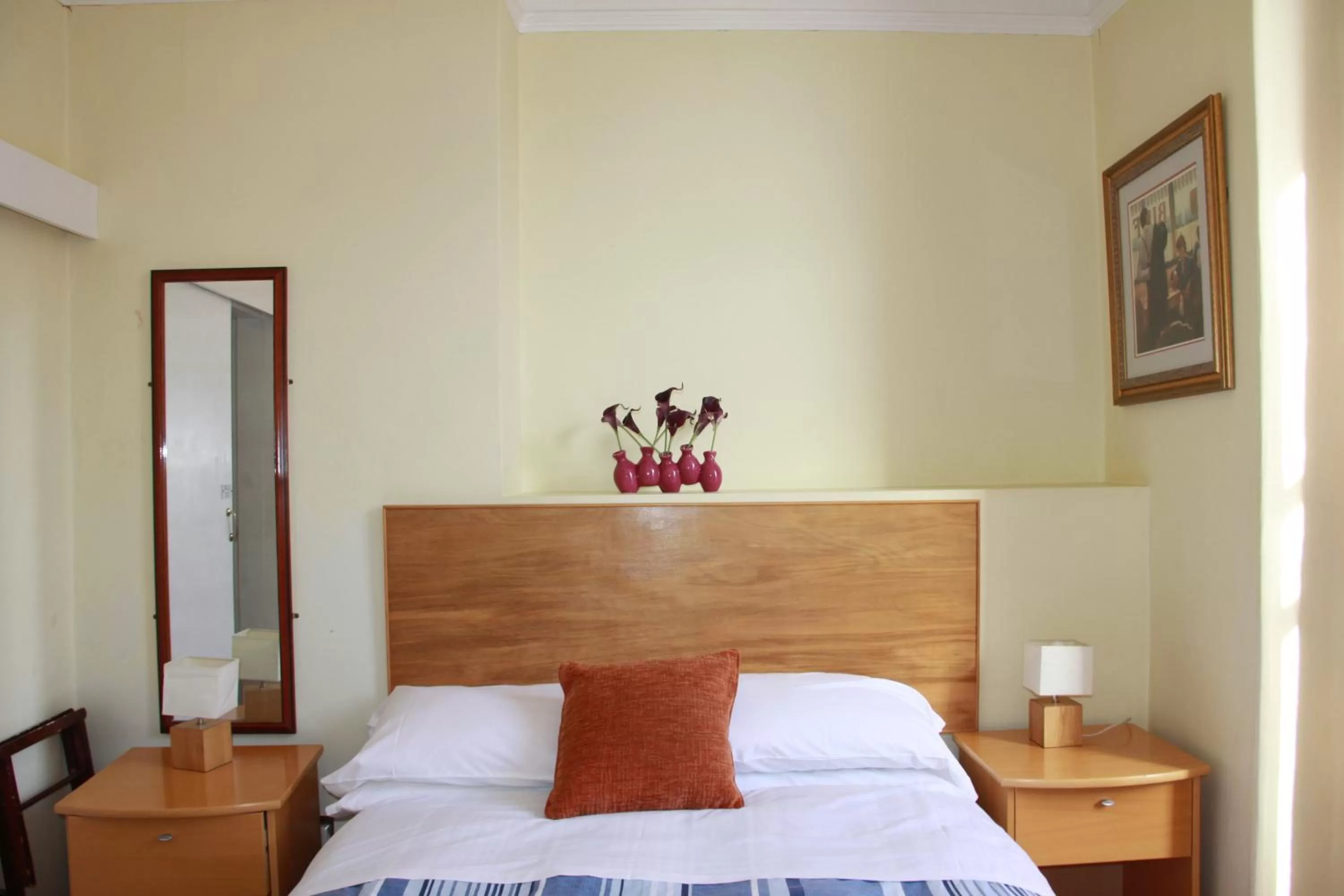 Bed in Ambassador Hotel