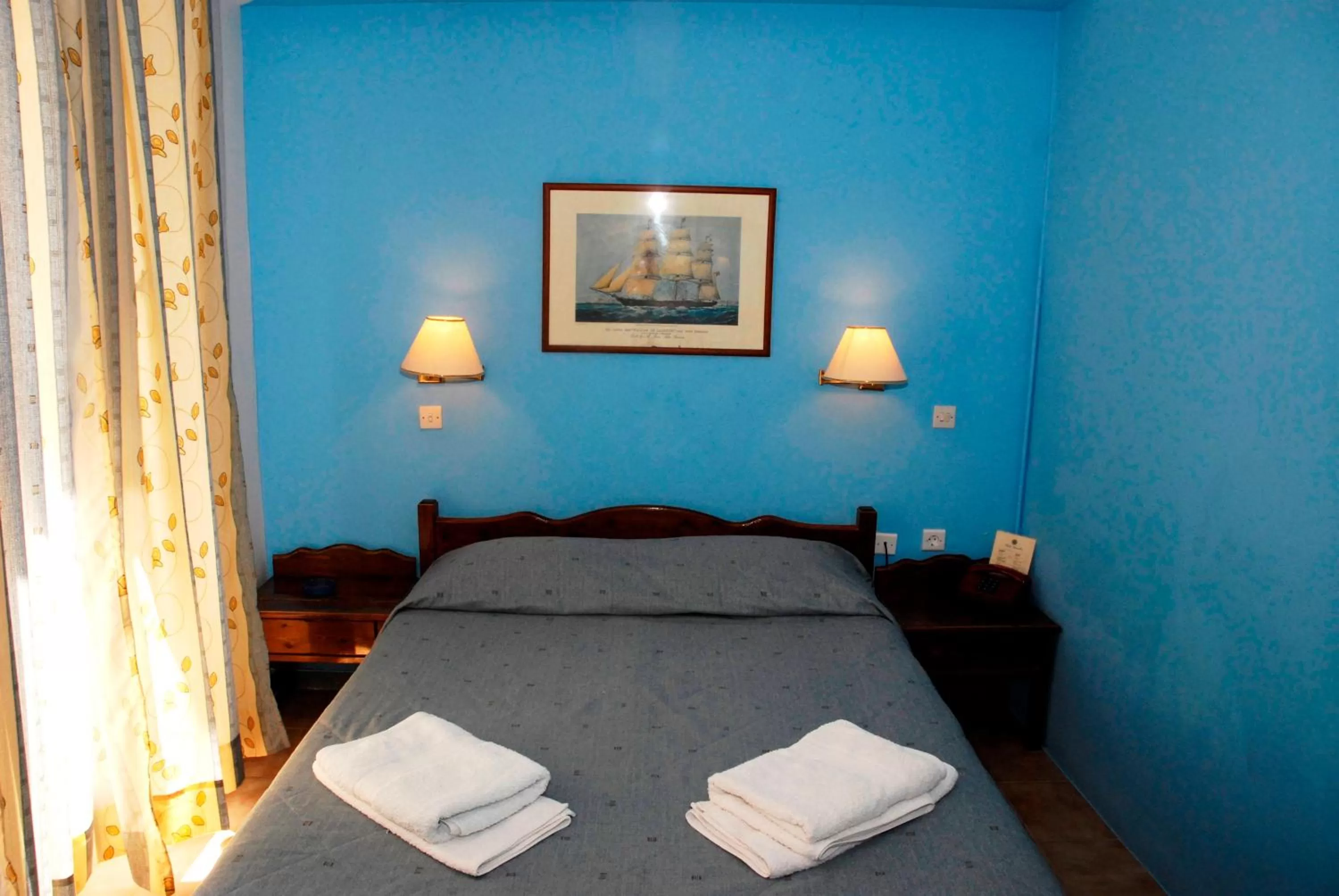 Bed in Amaryllis Hotel