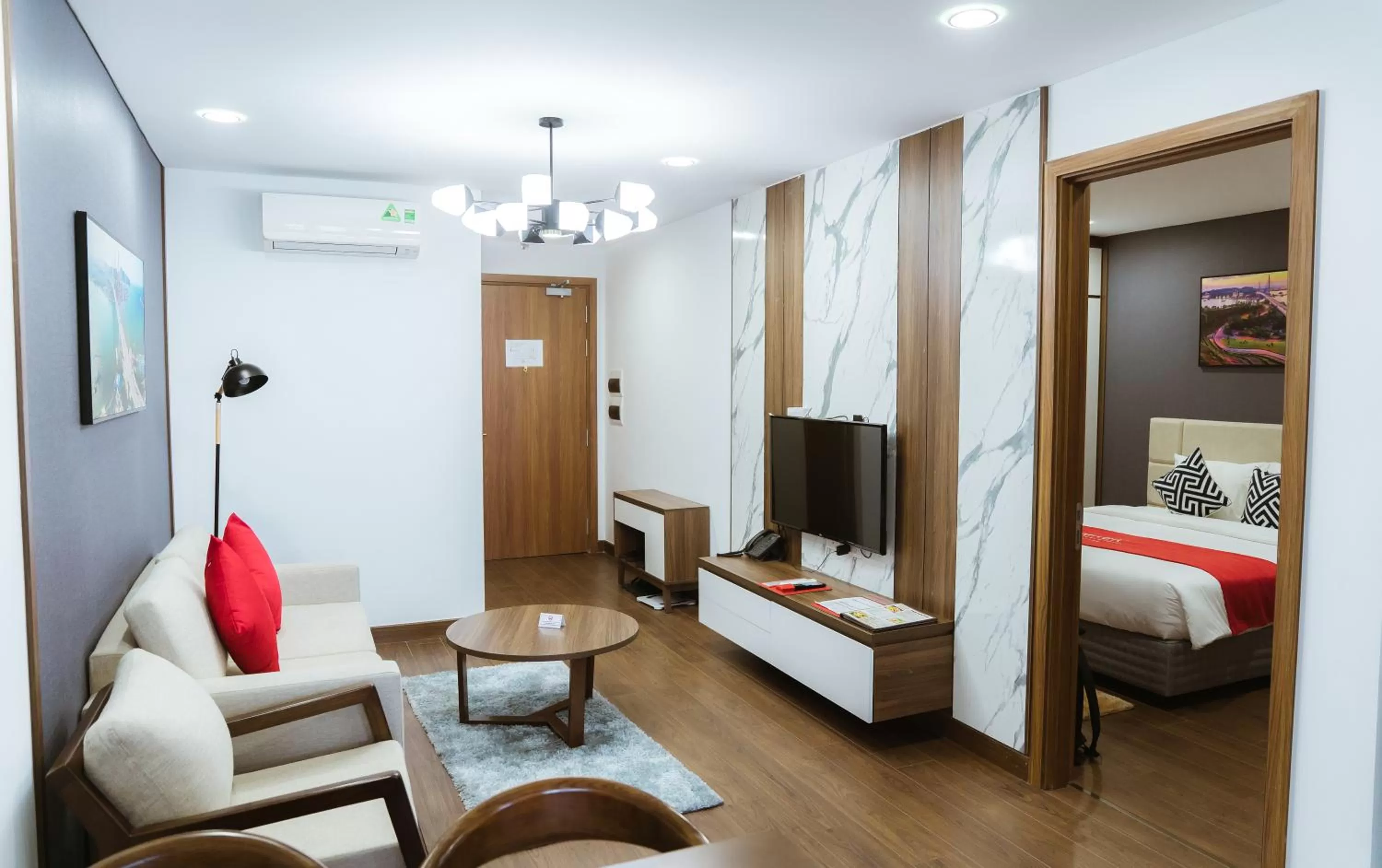 Living room, Bed in Ramada Hotel & Suites by Wyndham Halong Bay View