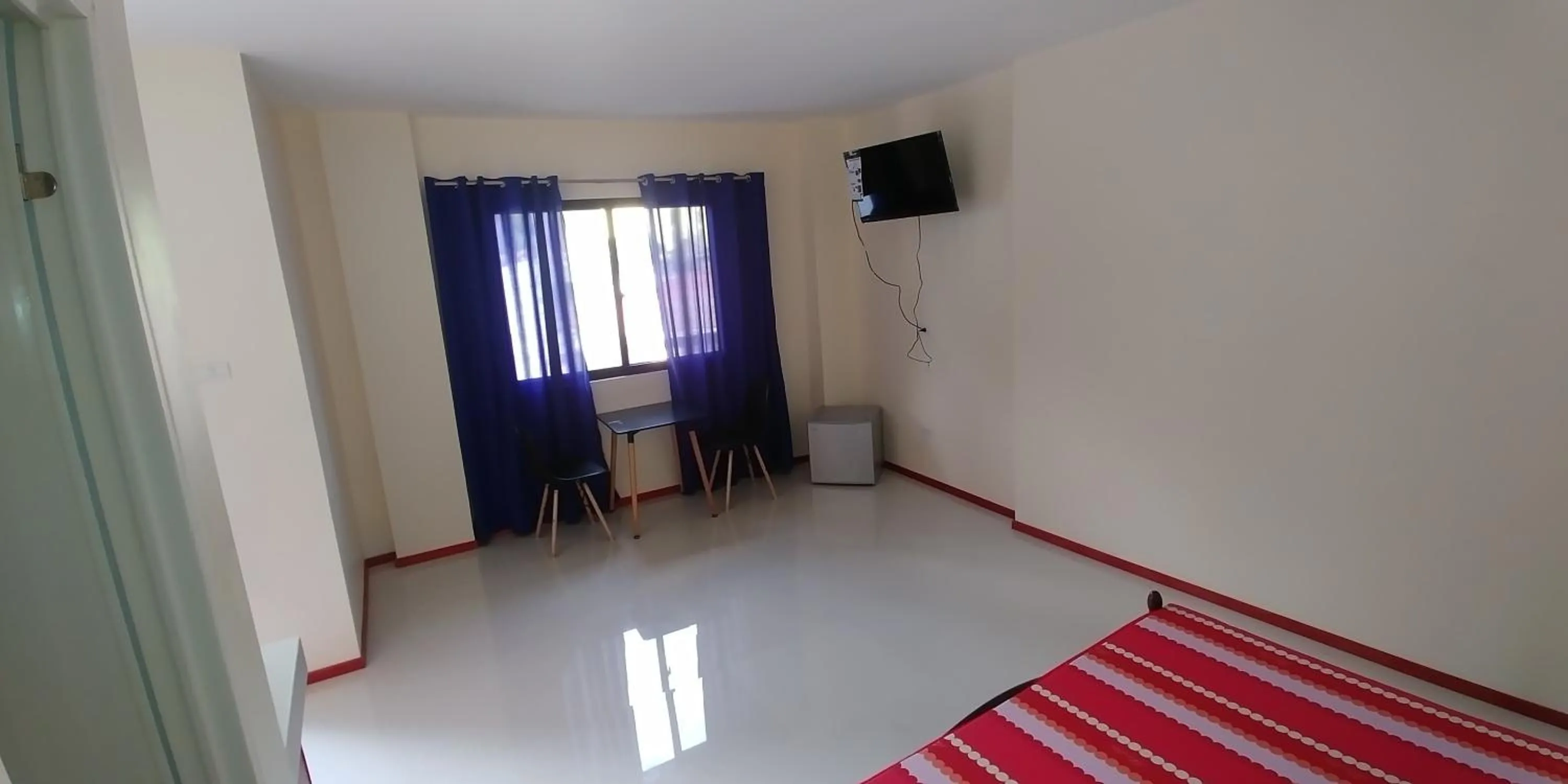 Bed in Squares Beachside Apartments