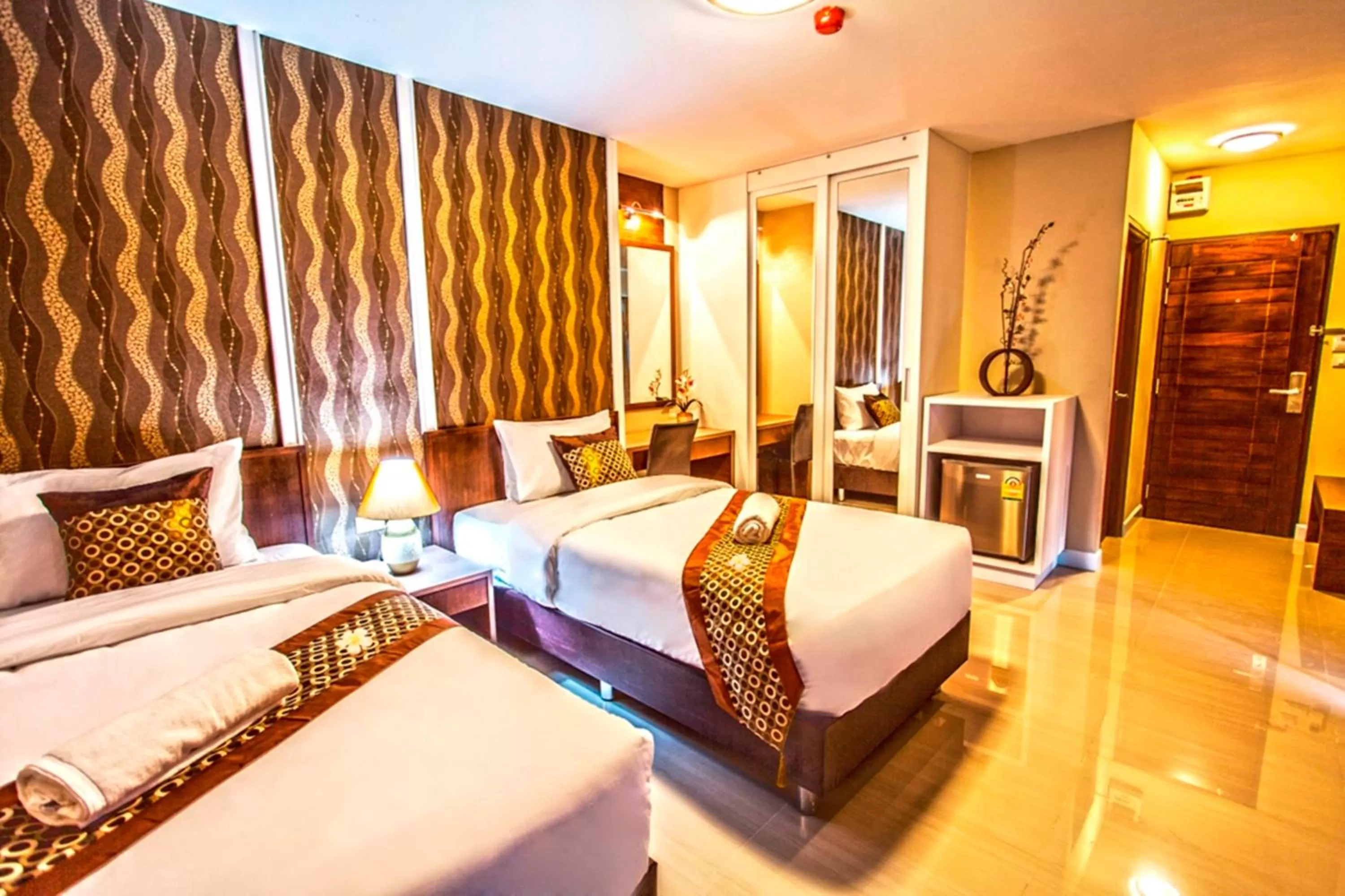 Photo of the whole room, Bed in The Aim Sathorn Hotel