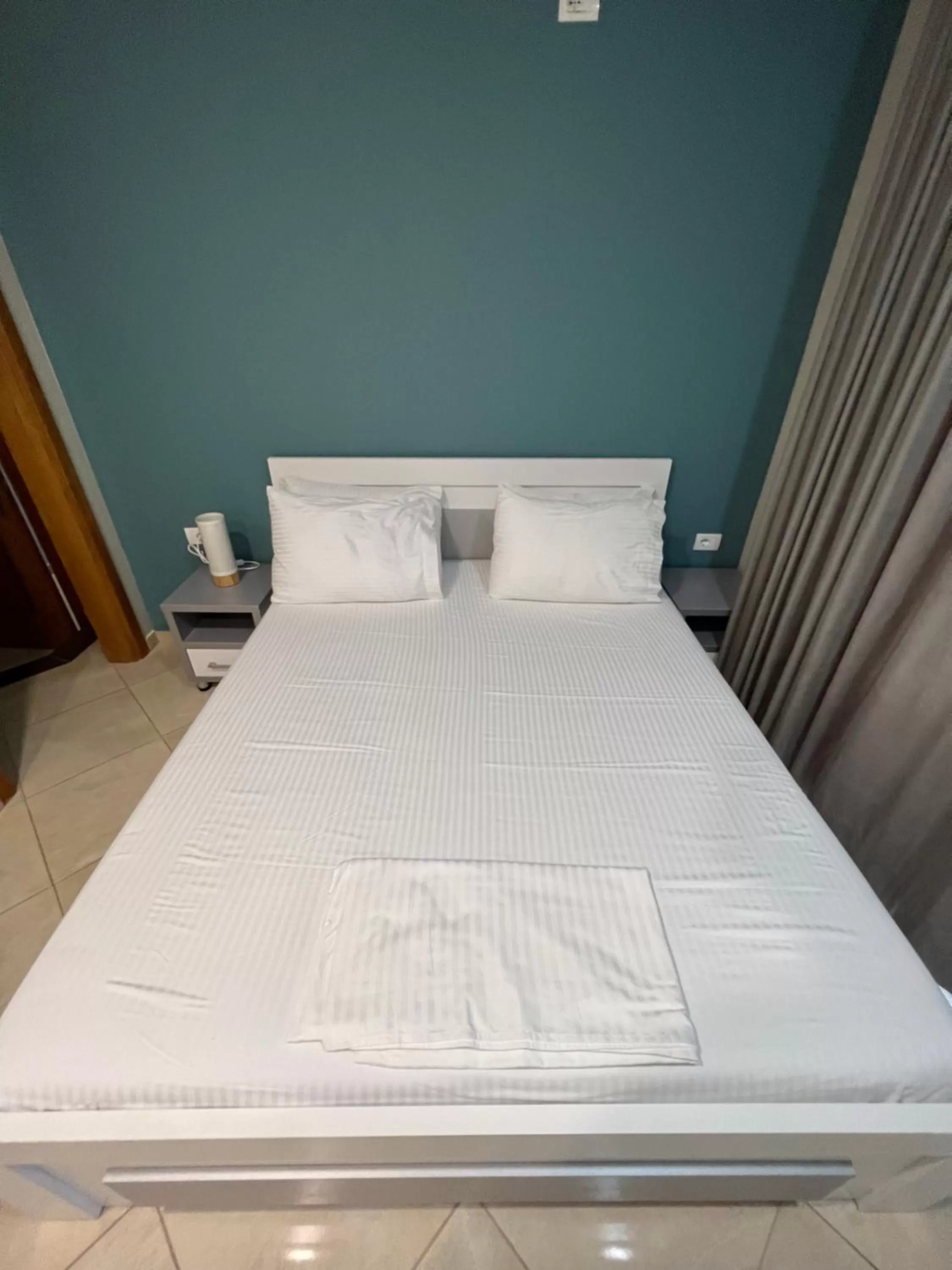 Bed in Aphrodite Garden Rooms & Apartment