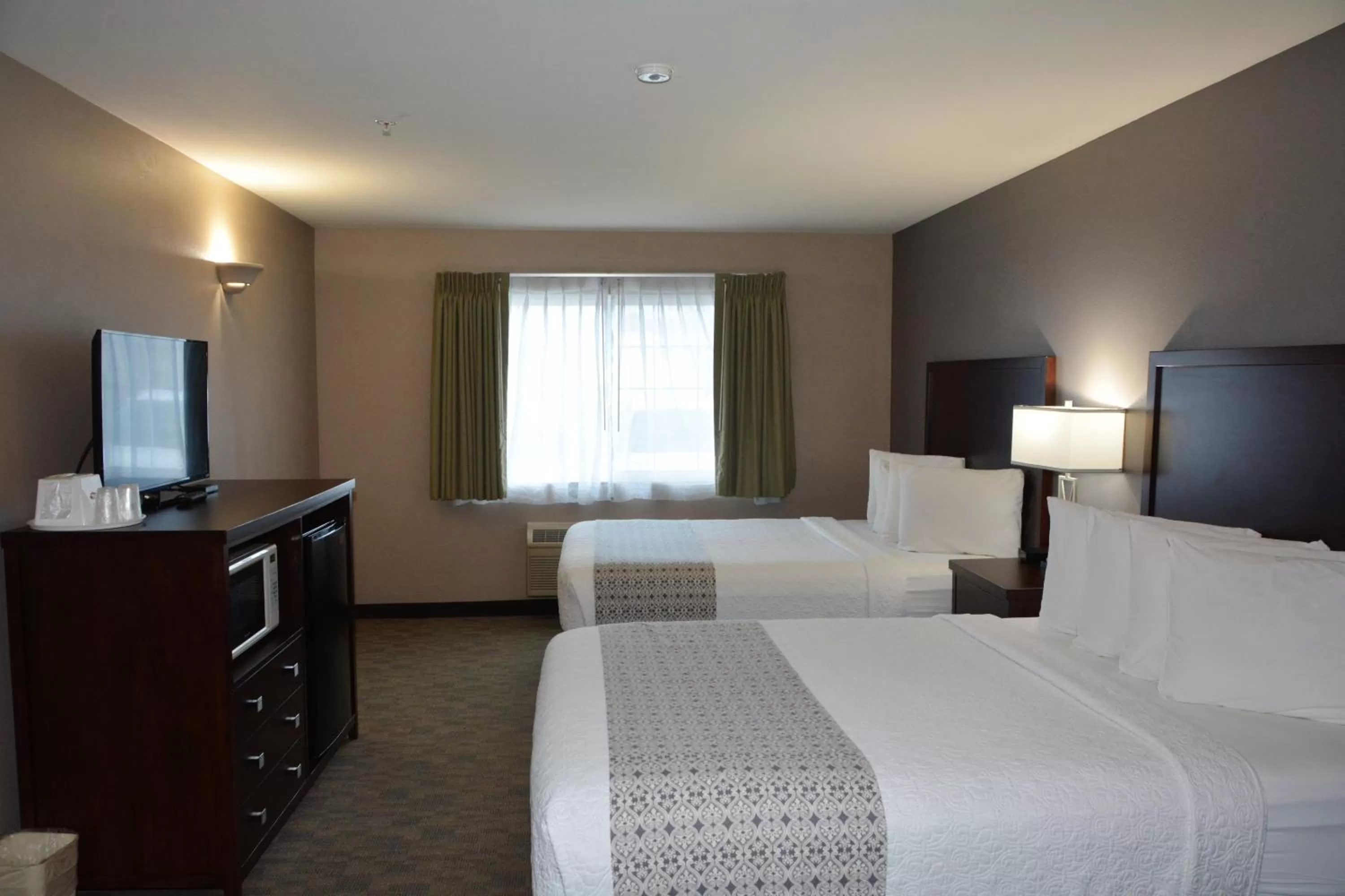 Bed in FairBridge Inn & Suites DuPont