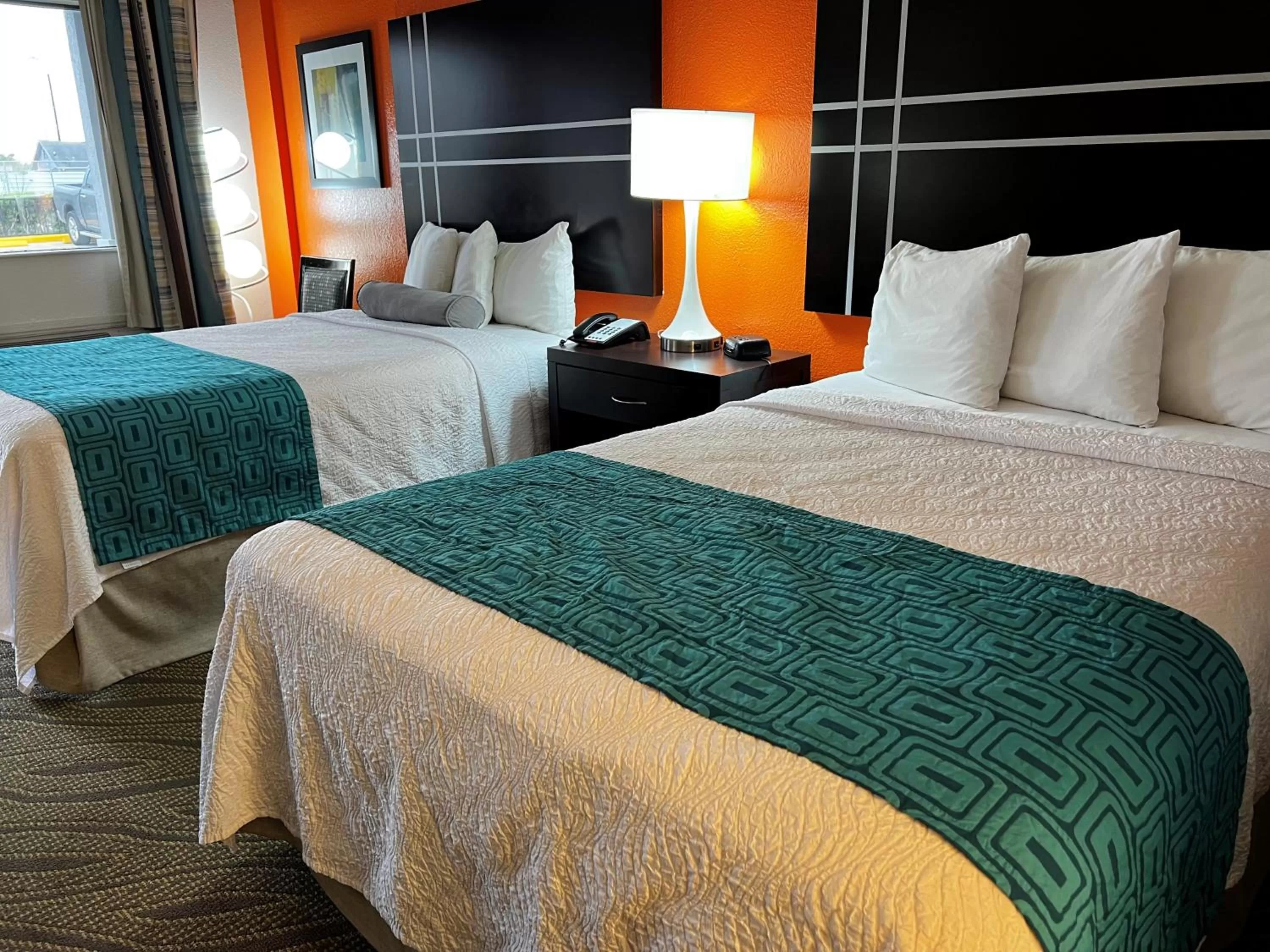 Bed in Howard Johnson by Wyndham Houston Heights Downtown