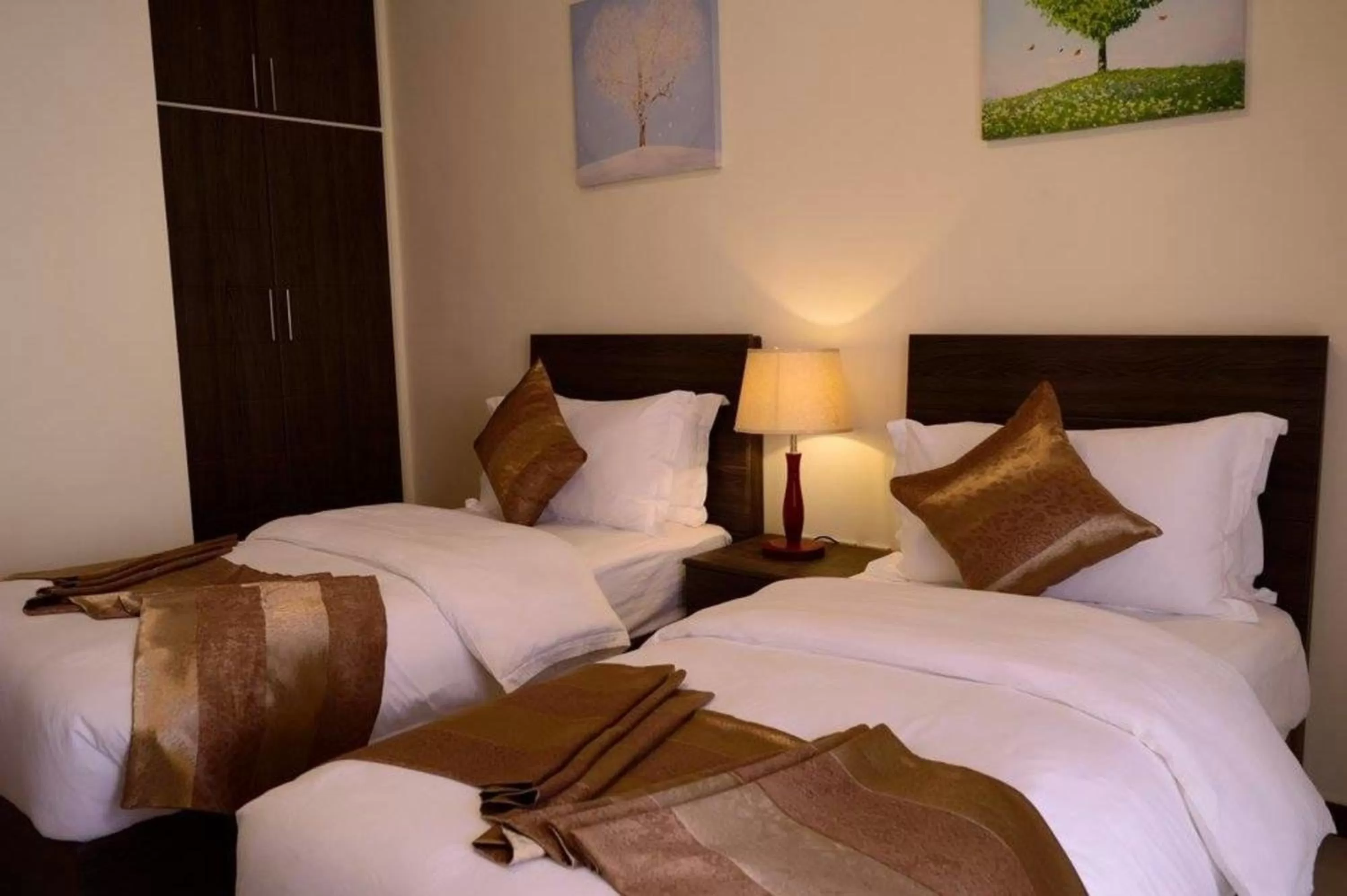 Bed in Olive Hotel Amman