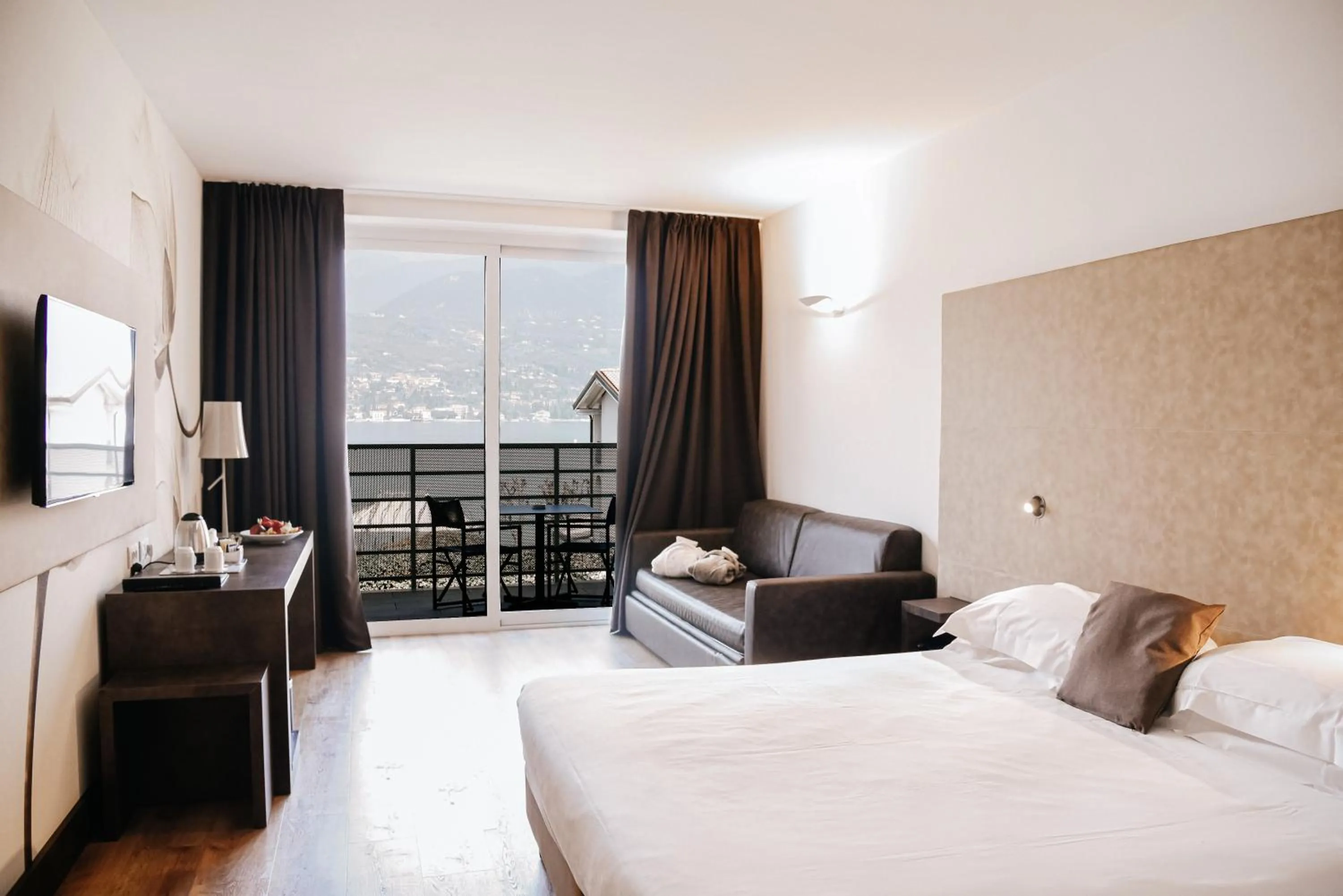 Balcony/Terrace, Bed in Bella Hotel & Restaurant with private dock for mooring boats