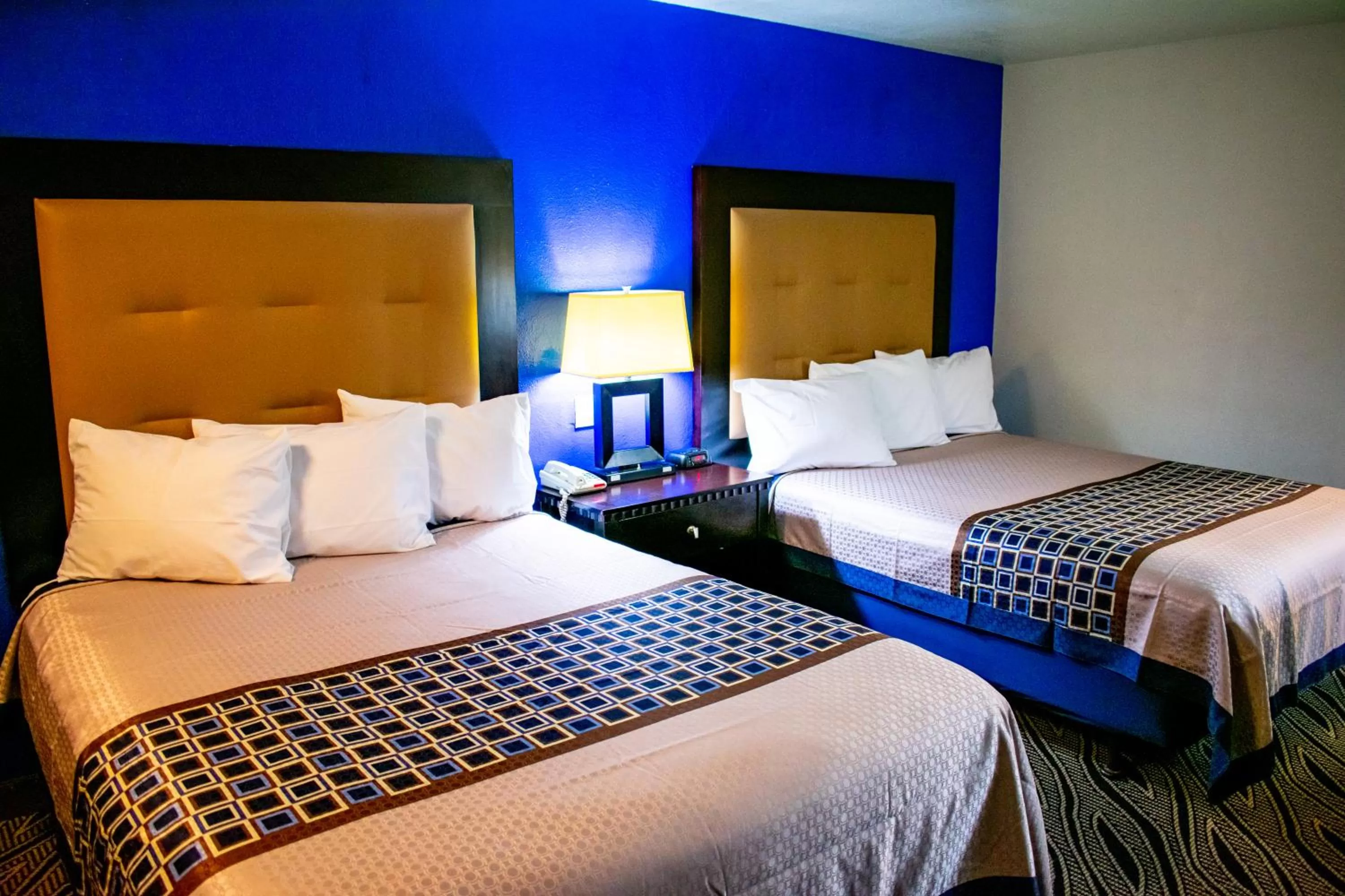 Bed in Blue Jay Inn & Suites